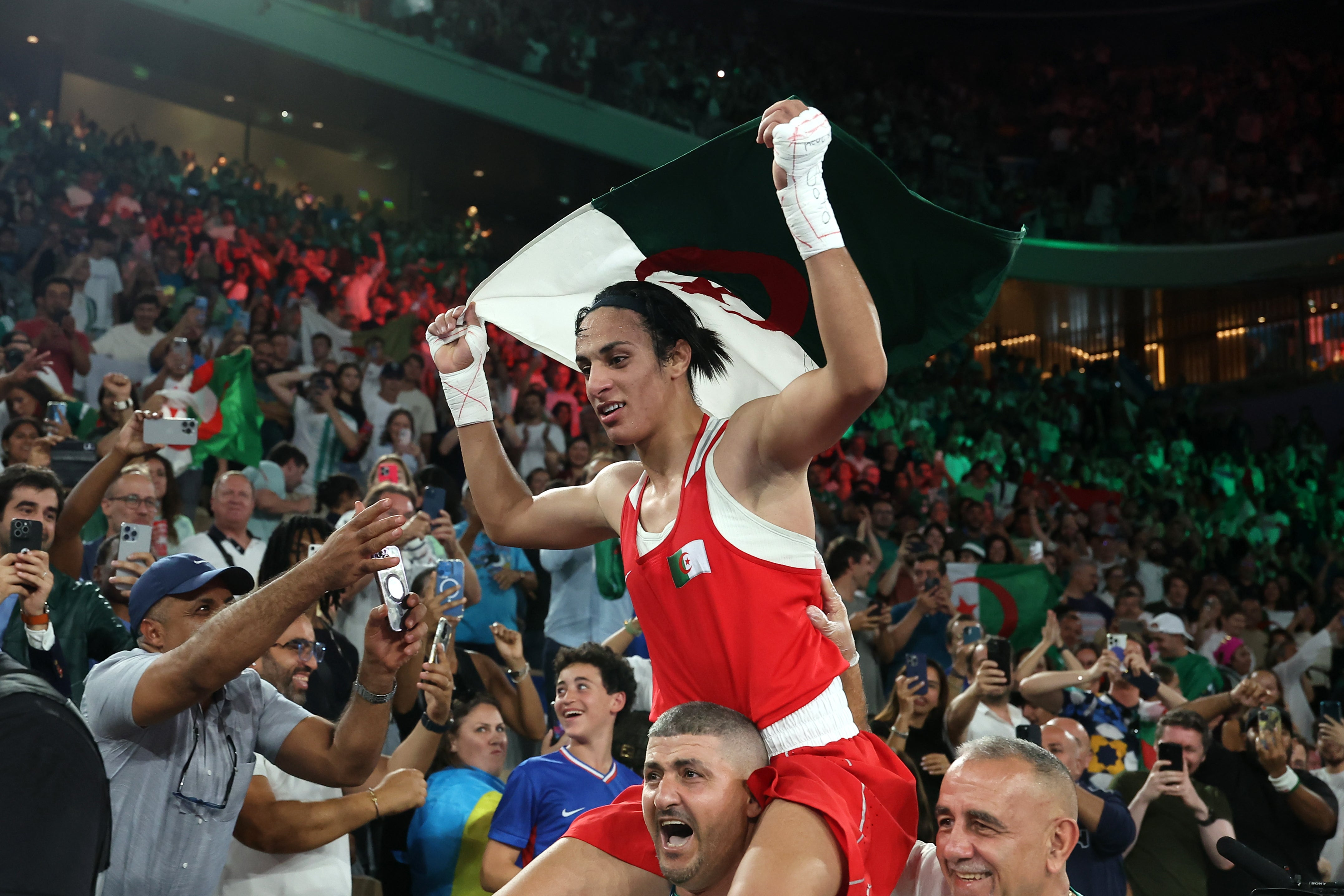 Imane Khelif celebrates her Olympic gold medal with Algeria fans in Paris