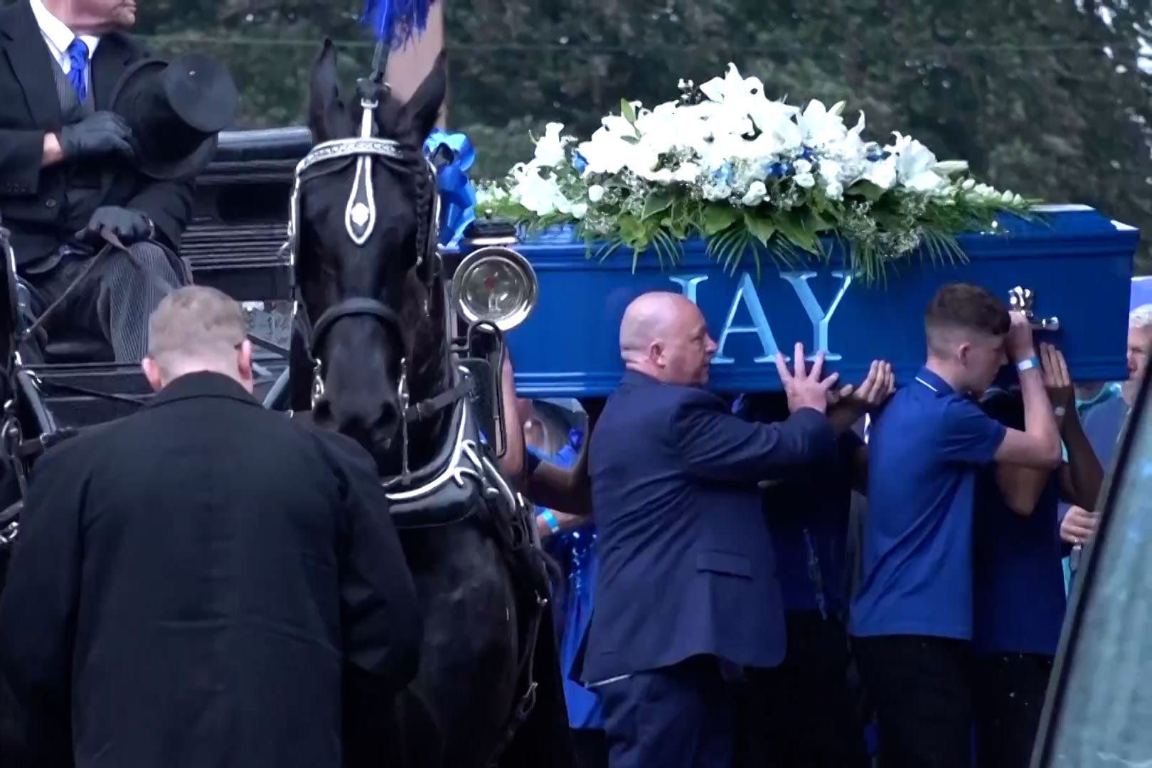 The coffin of Jay Slater being carried into Accrington Cemetery Chapel (Acacia Redding/PA)