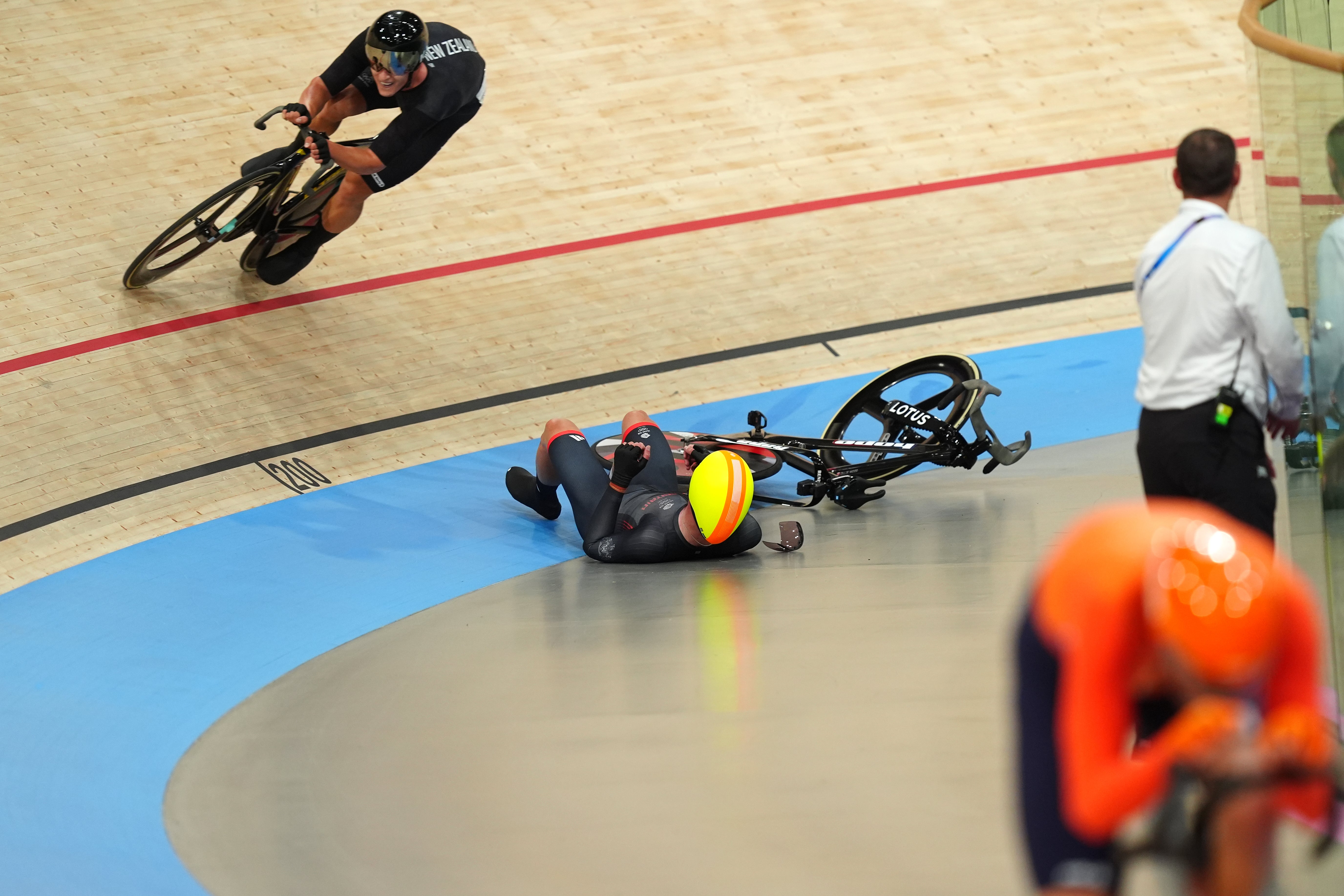 Great Britain's Oliver Wood crashes after a collision in the Men's Madison