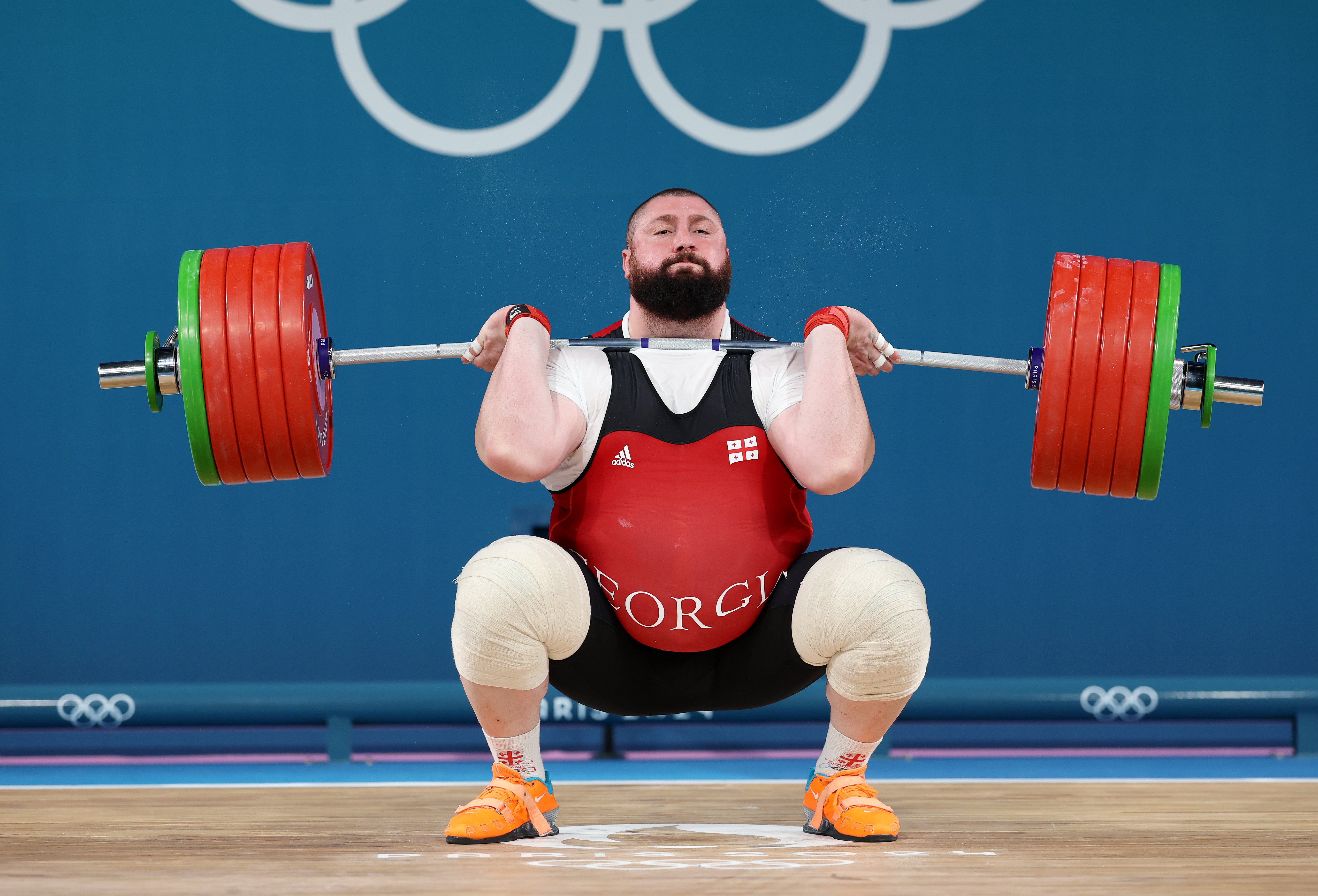 Lasha Talakhadze of Team Georgia performs a clean and jerk