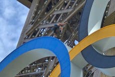 Eiffel Tower evacuated after man seen climbing hours before Olympics closing ceremony