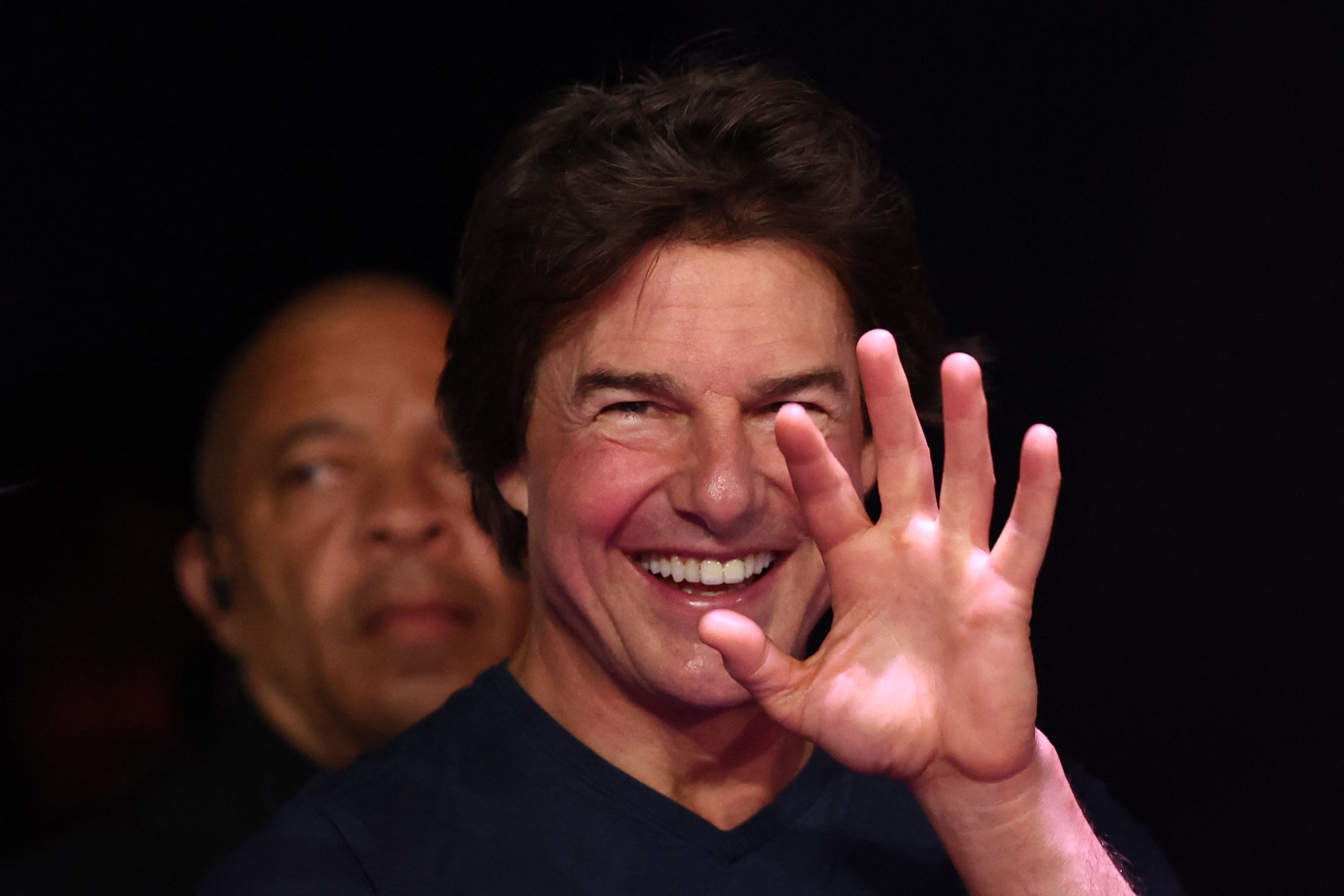 Tom Cruise reacts as he attends the closing ceremony of the Paris 2024 Olympic Games