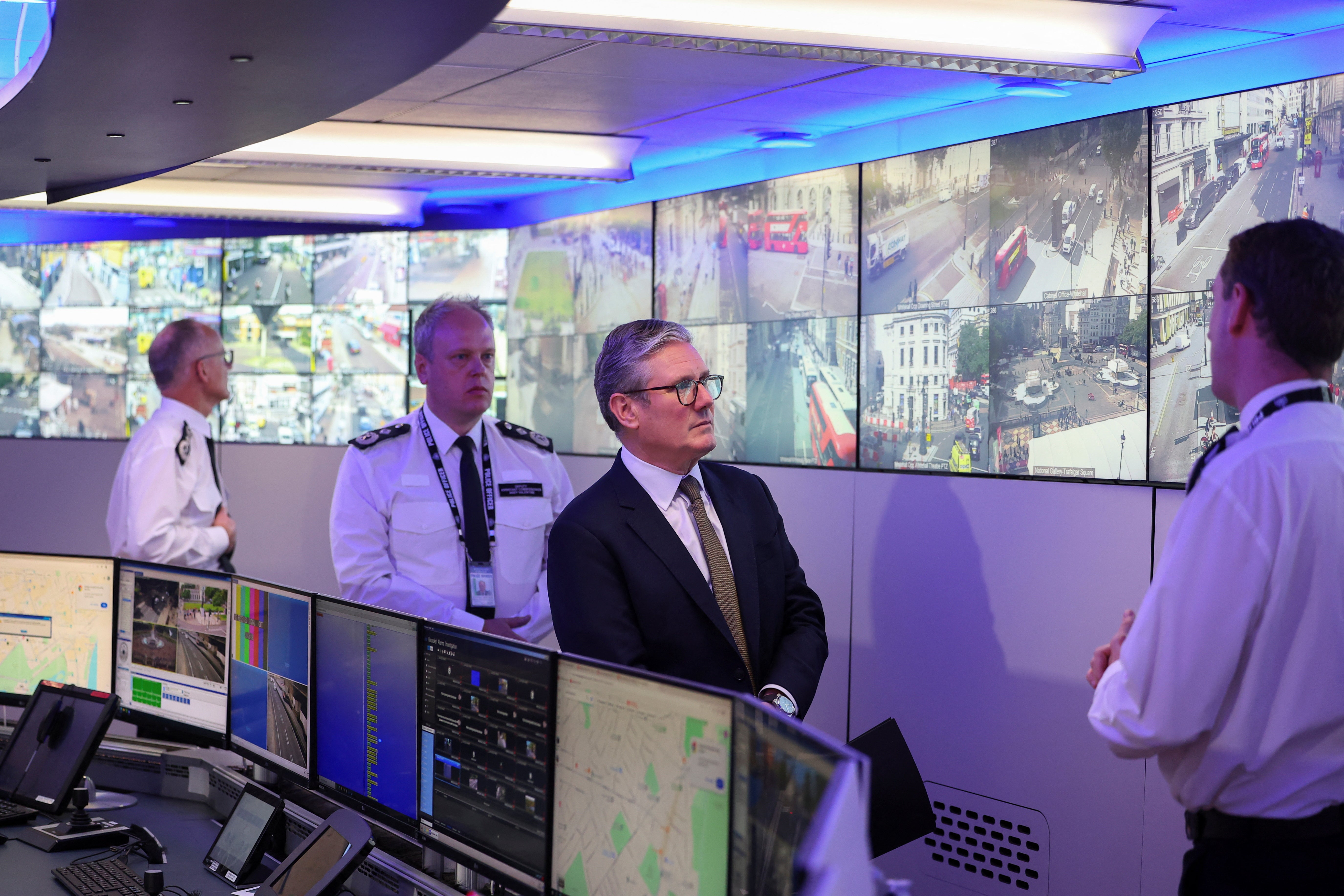 Sir Keir Starmer (third from left), pictured at the Metropolitan Police Command and Control Special Operations Room at Lambeth Police Headquarters (Toby Melville/PA)