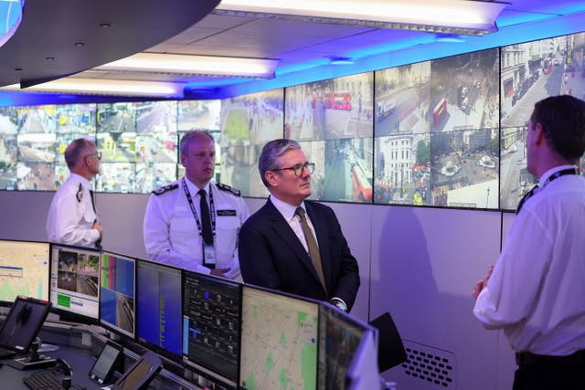 <p>Sir Keir Starmer (third from left), pictured at the Metropolitan Police Command and Control Special Operations Room at Lambeth Police Headquarters (Toby Melville/PA)</p>