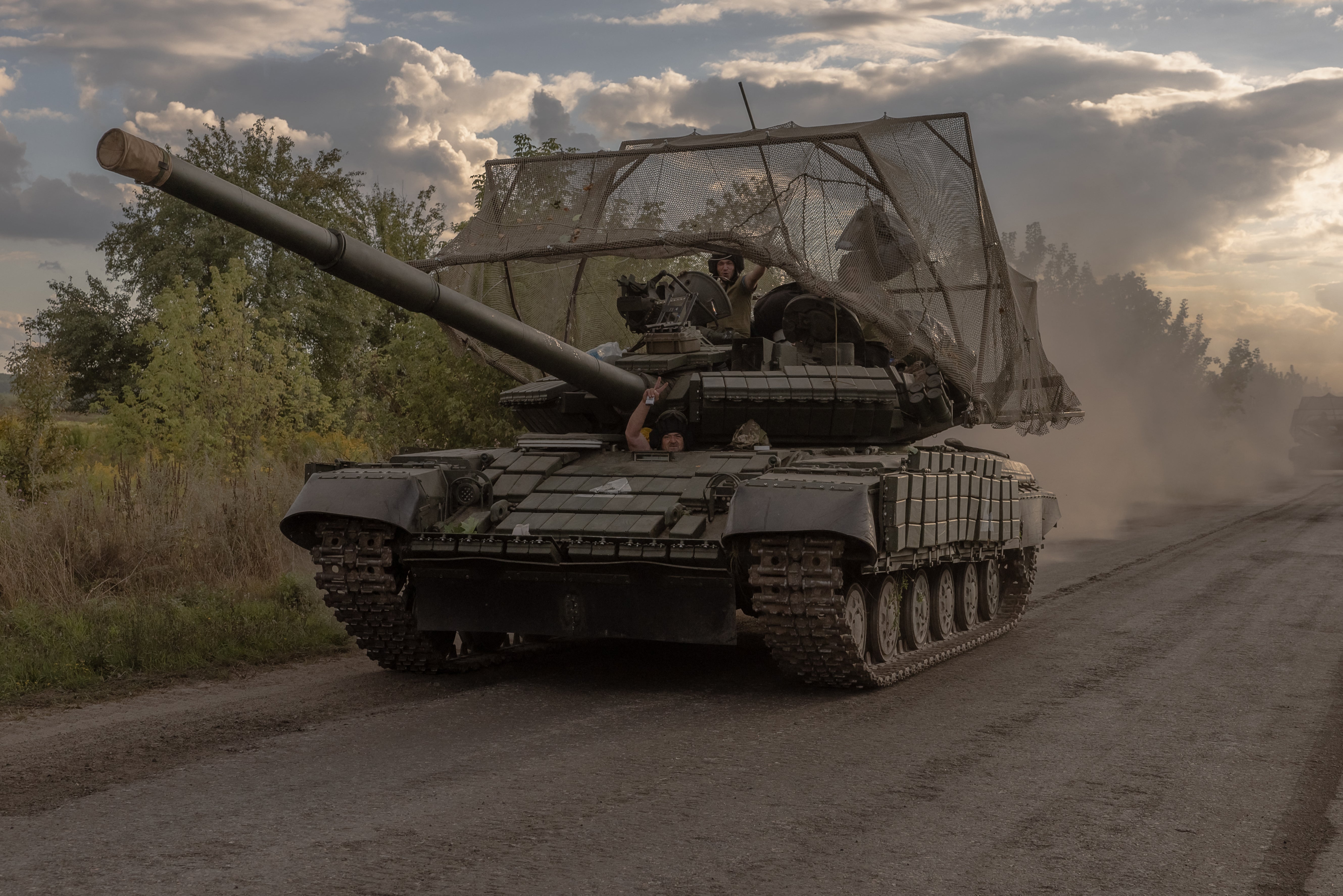 Ukrainian servicemen drive Soviet-made T-64 tanks in the Sumy region, near the border with Russia