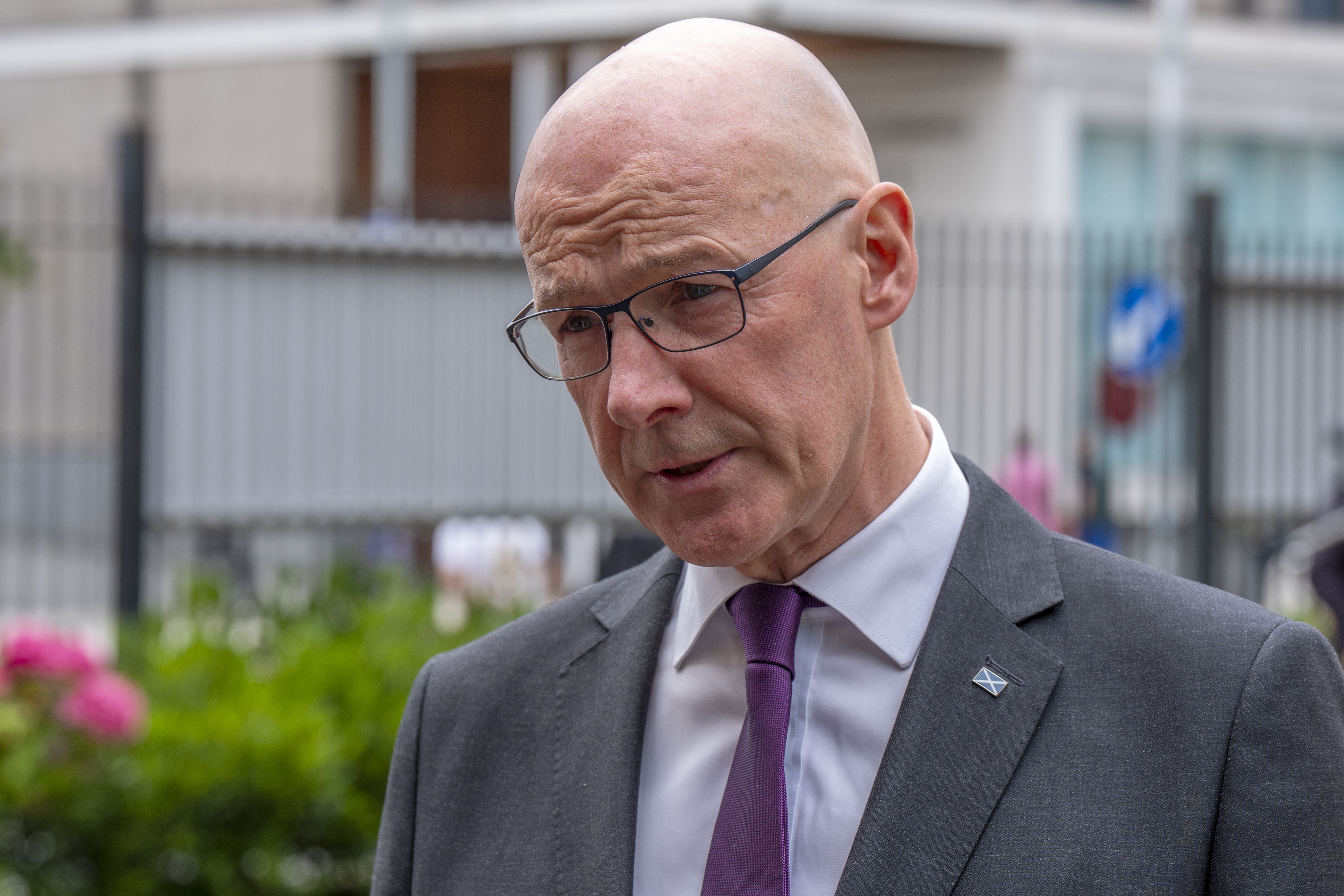 John Swinney has warned tough decisions will be taken to accommodate the improved pay offer (Jane Barlow/PA)