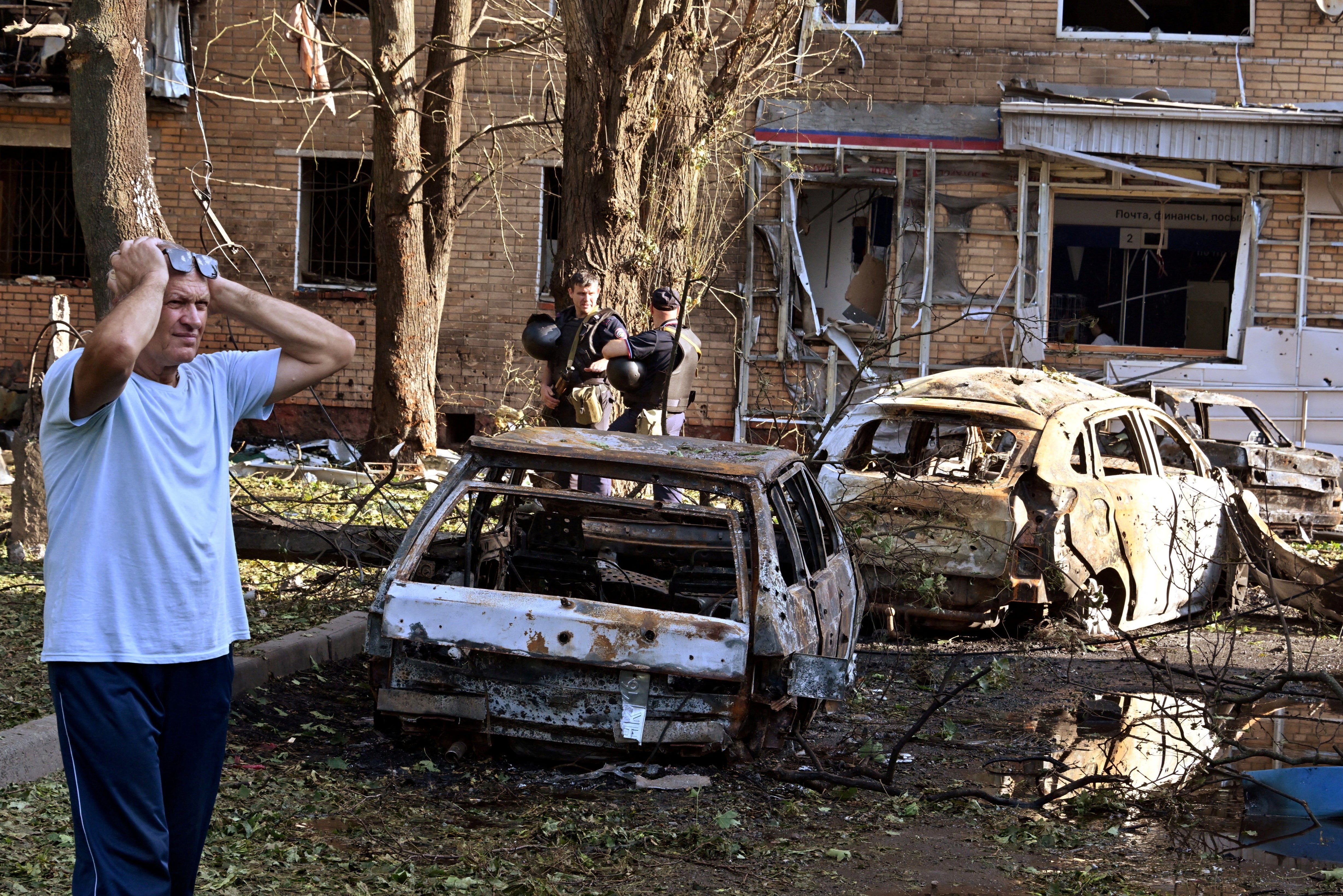 Burnt-out remains of cars in a town in the Kursk region on Monday