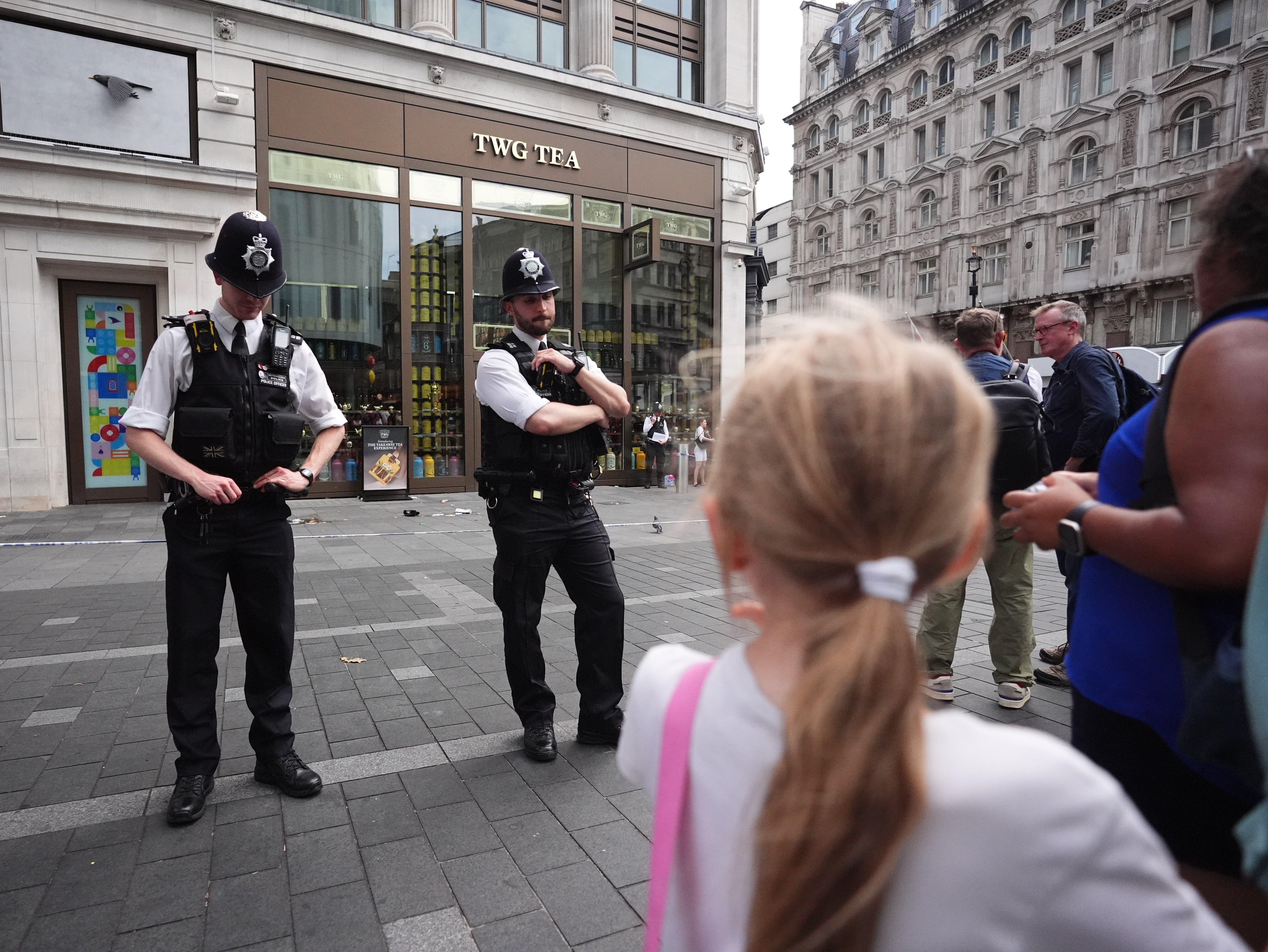 Police officers at the scene in Leicester Square (James Manning/PA)