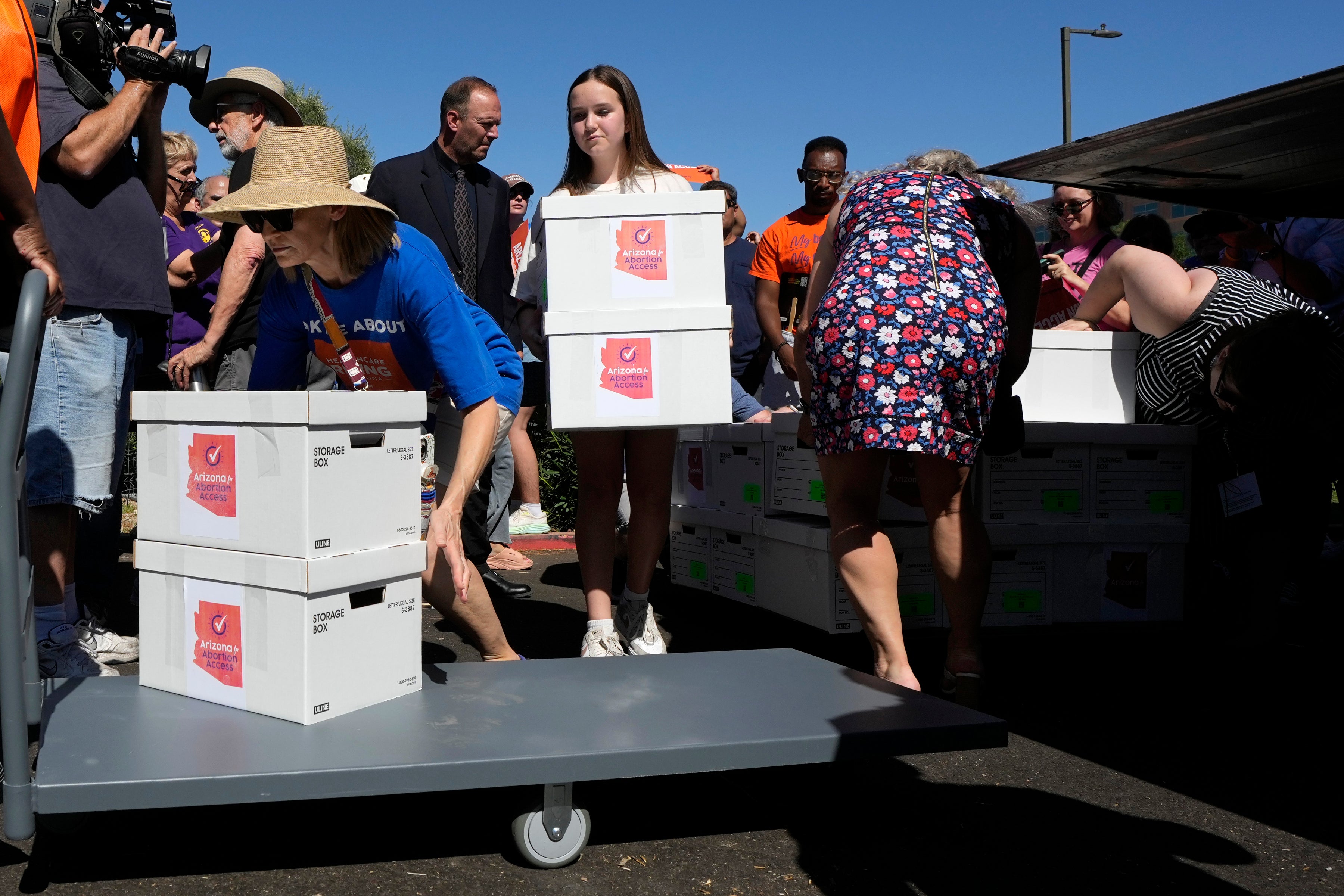 Arizona abortion-rights supporters deliver over 800,000 petition signatures to the Capitol to get an amendment enshrining abortion rights on the ballot