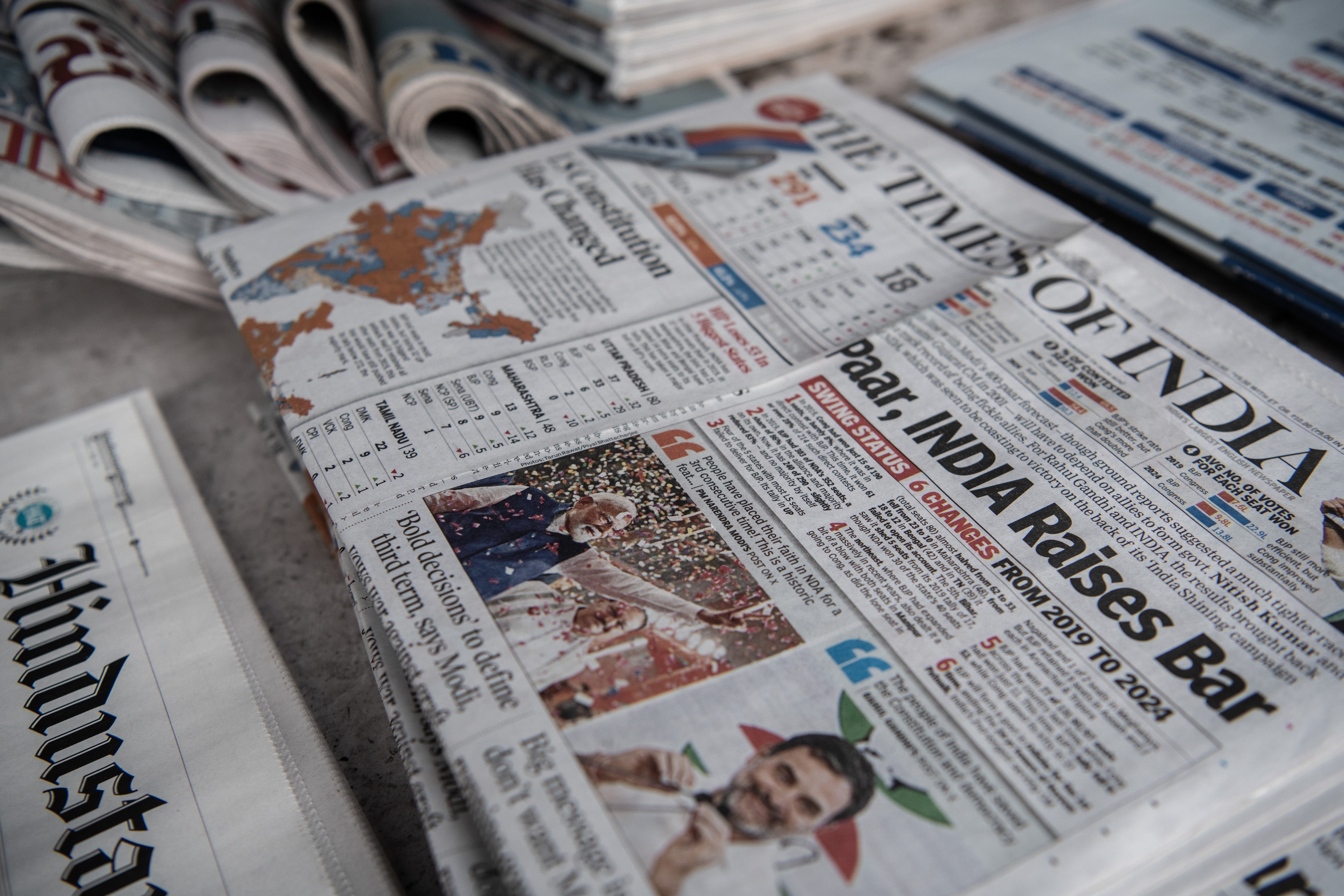 Indian newspapers bearing images of Narendra Modi, opposition leader Rahul Gandhi and politicians are seen the morning after the country’s general election results