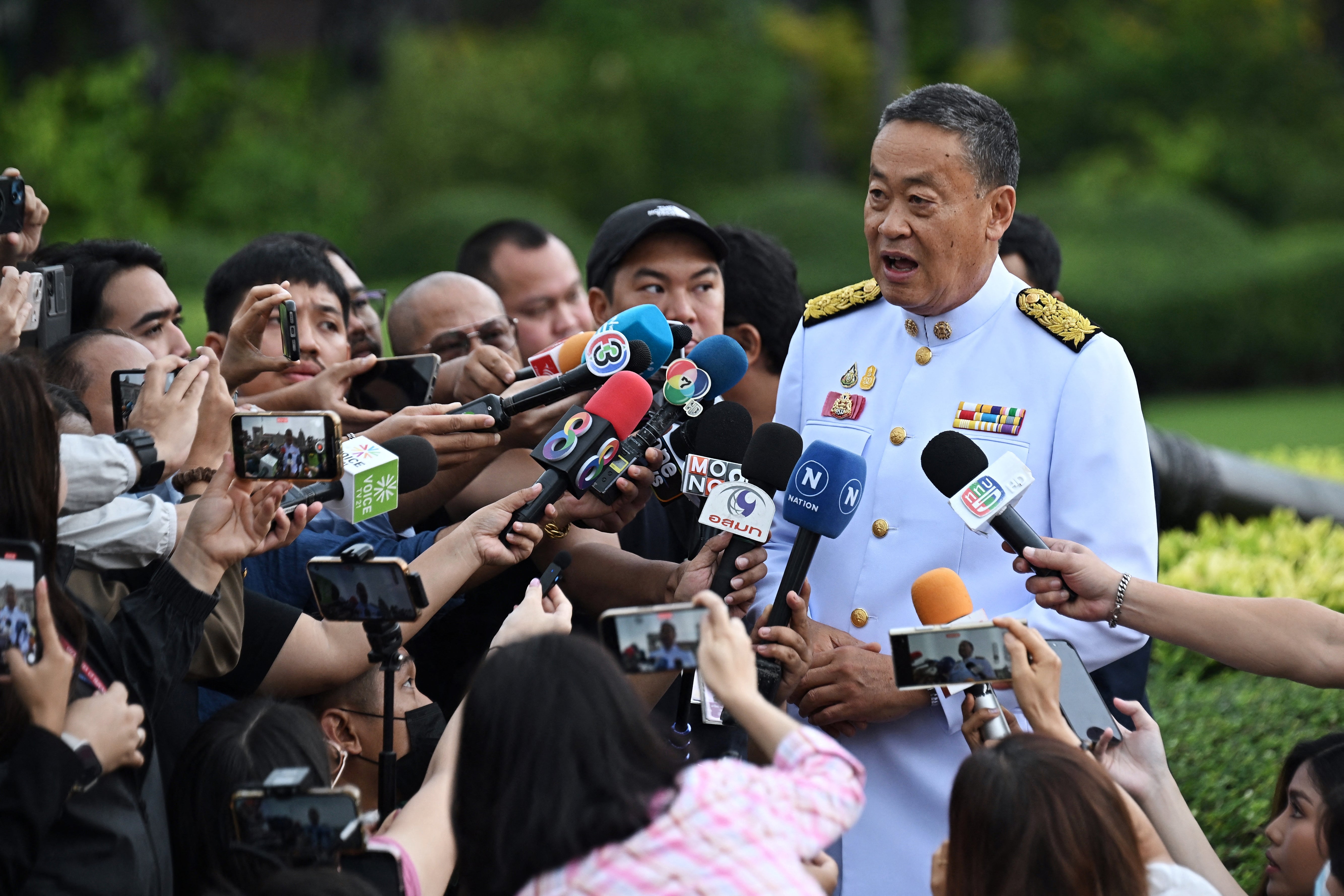 Thailand’s prime minister Srettha Thavisin speaks to reporters outside Government House in Bangkok