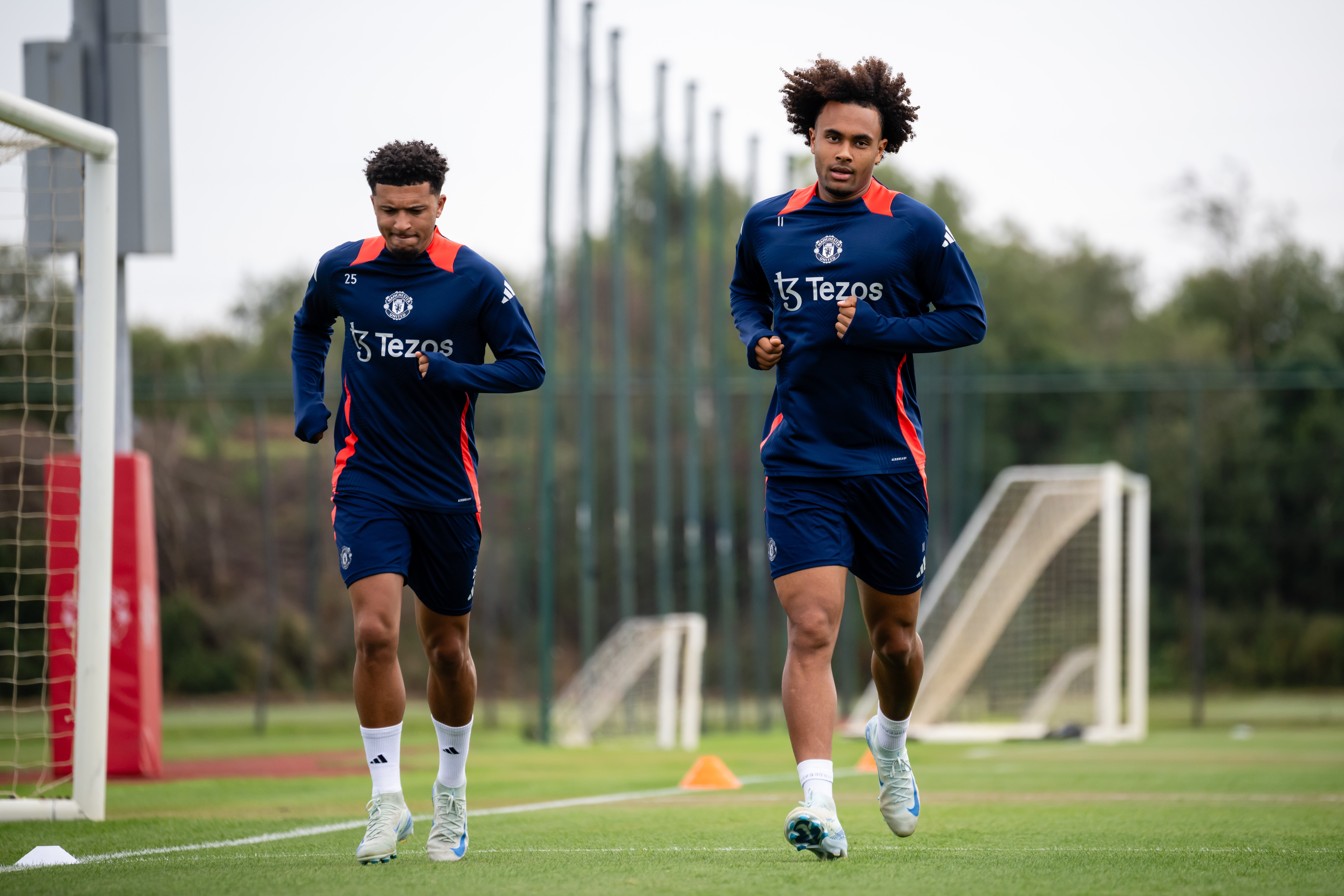 Jadon Sancho, Joshua Zirkzee of Manchester United in action during a first team training session at Carrington Training Ground