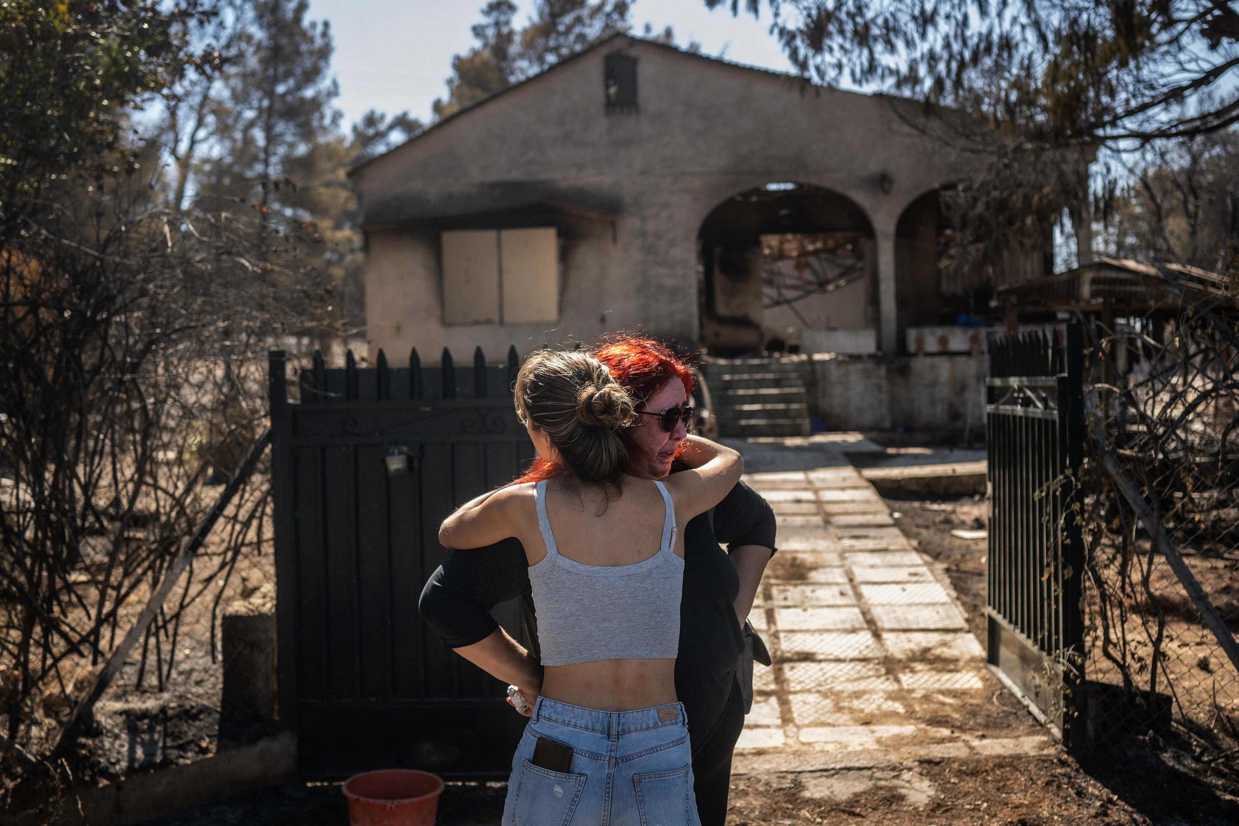 A home left damaged by a wildfire in the Chalandri suburb of Athens