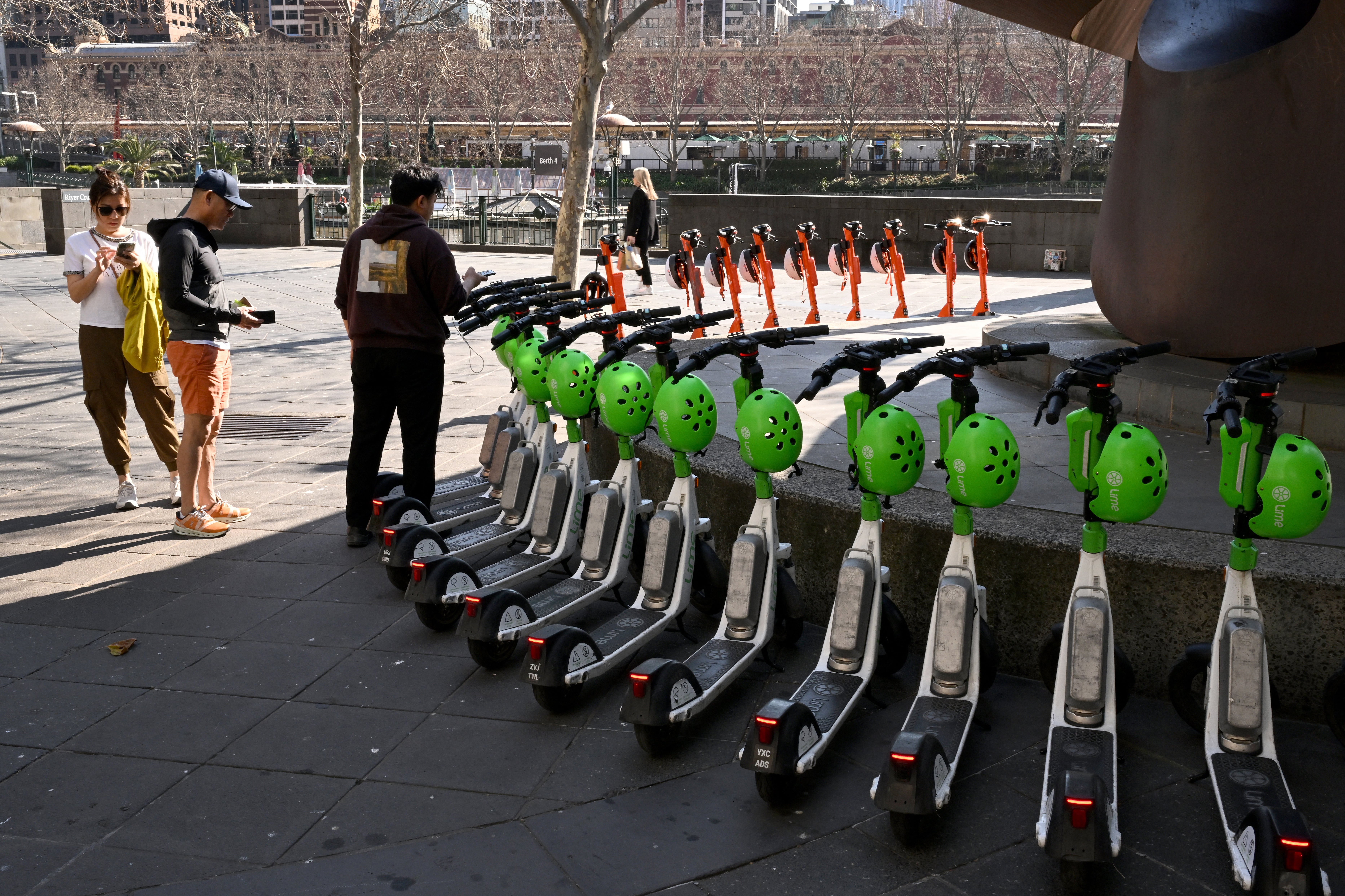 Rental electric scooters are lined up in Melbourne’s central business district on 13 August 2024