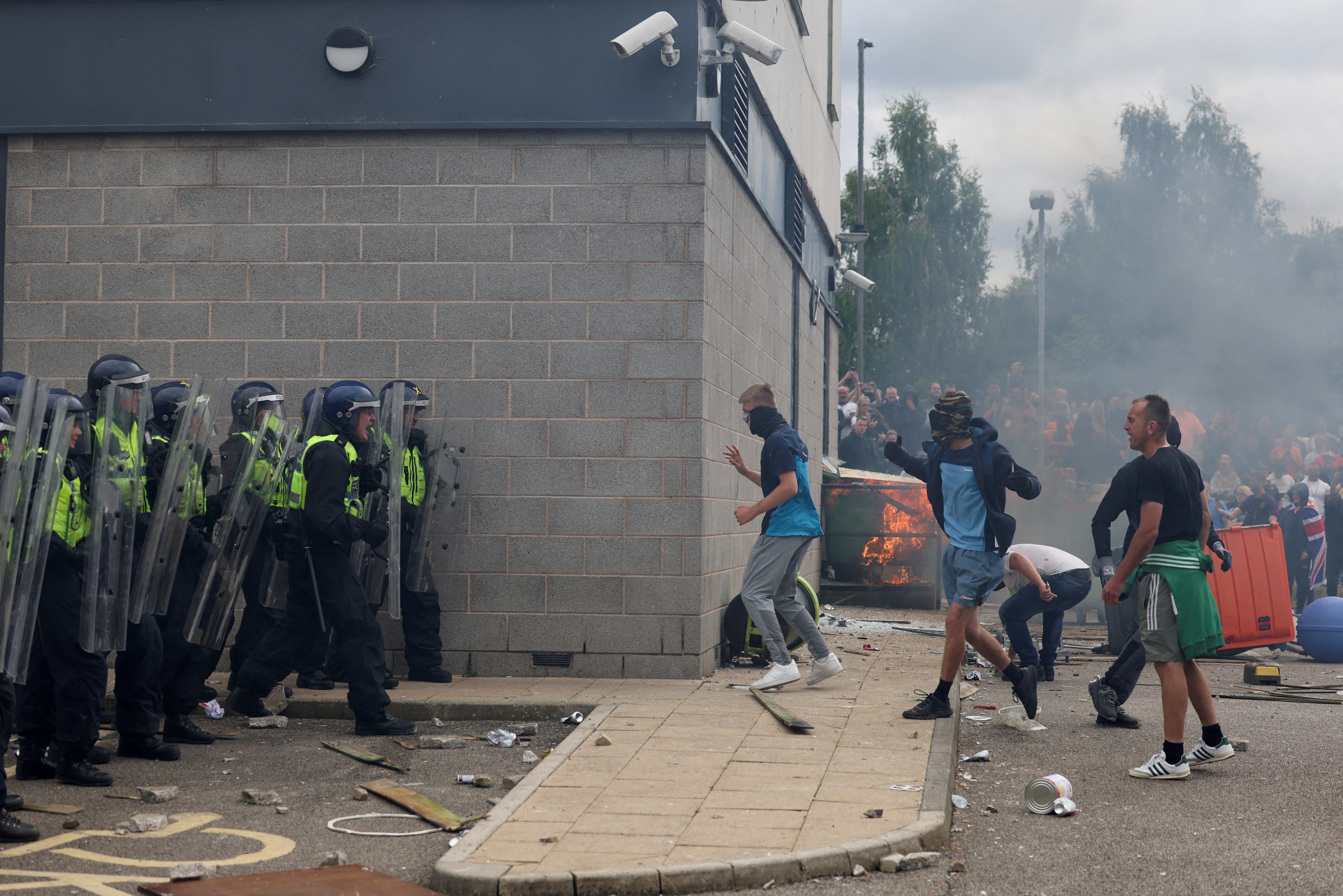 Demonstrators clash with police officers during an anti-immigration protest in Rotherham on 4 August