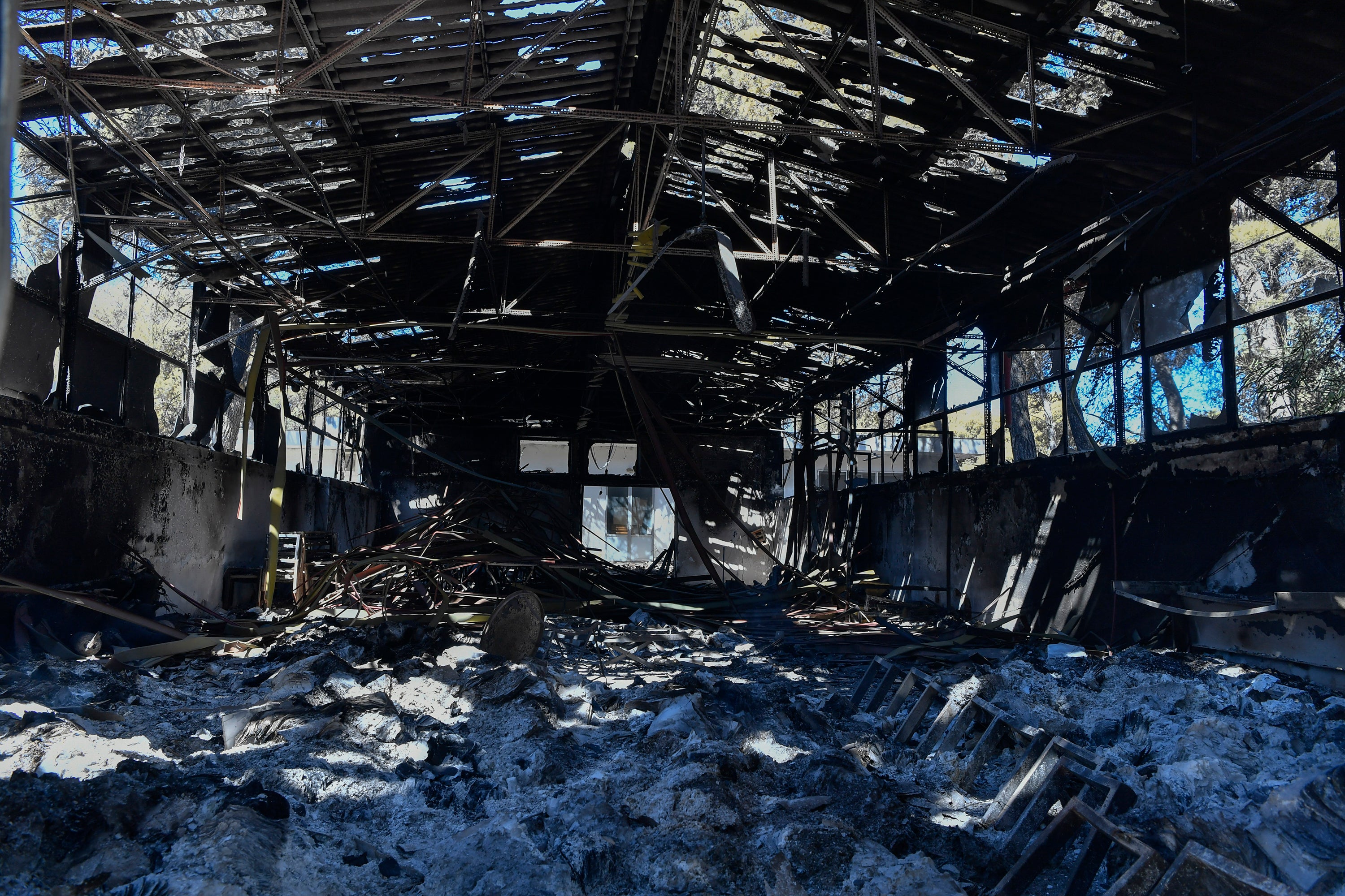 A view of a burned warehouse in Nea Penteli suburb of Athens