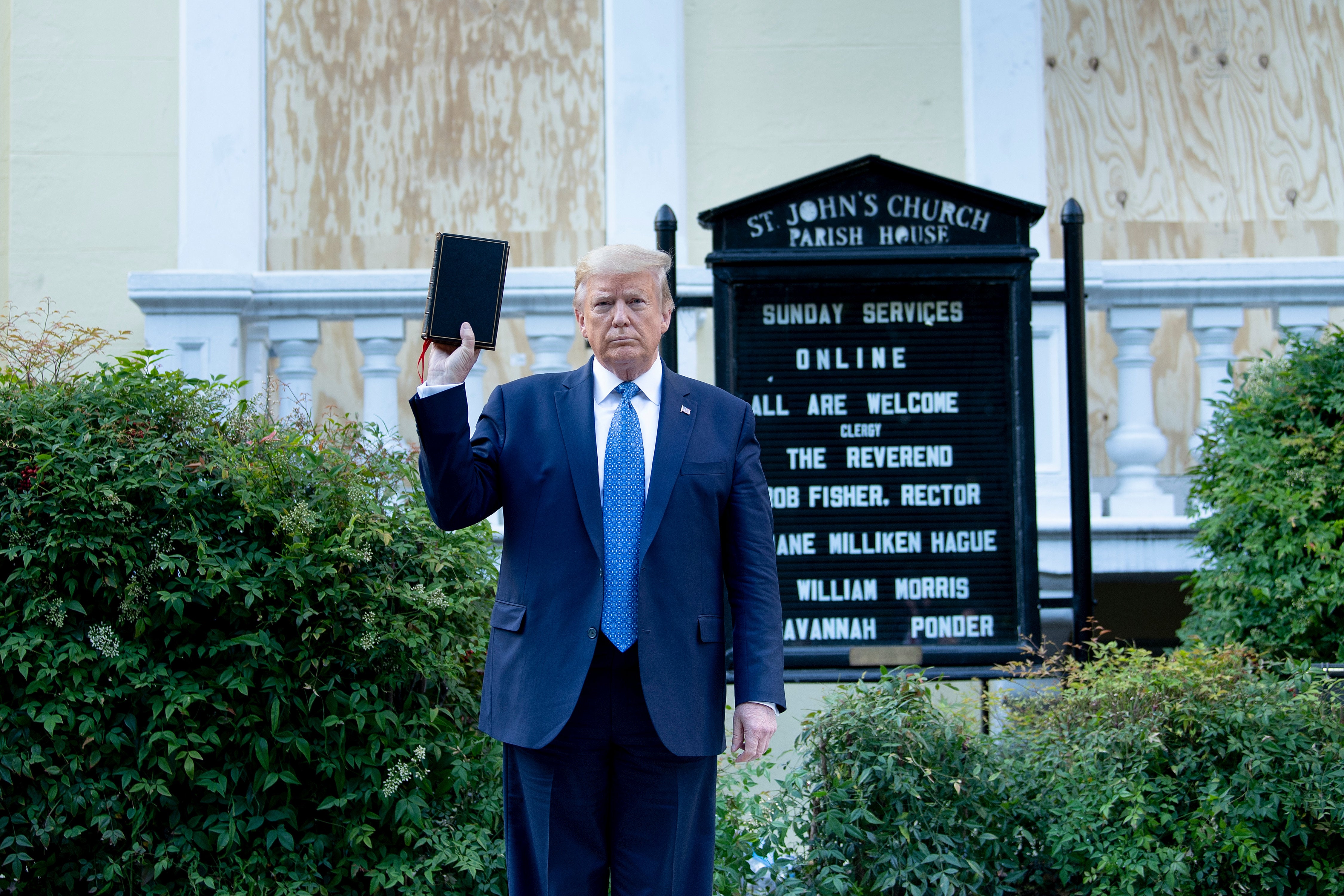 US President Donald Trump holds a Bible while visiting St. John’s Church across from the White House