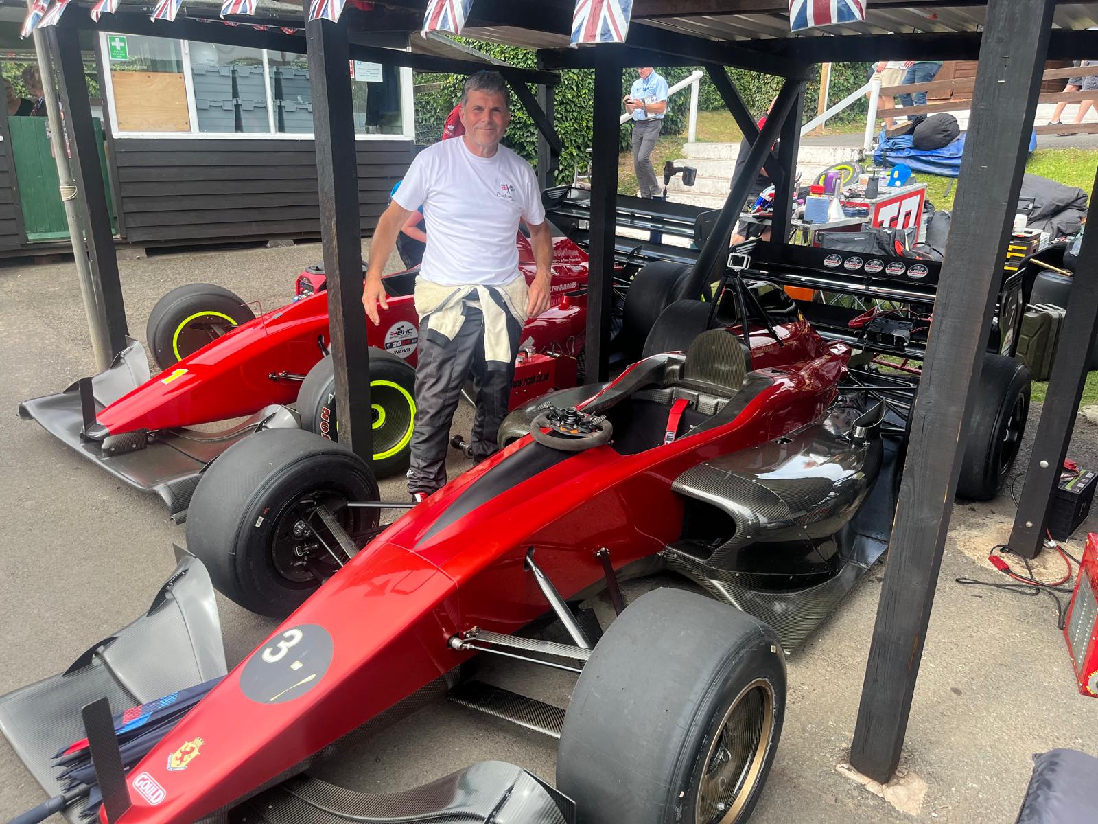 Gould poses with the record-setting Gould GR59 car