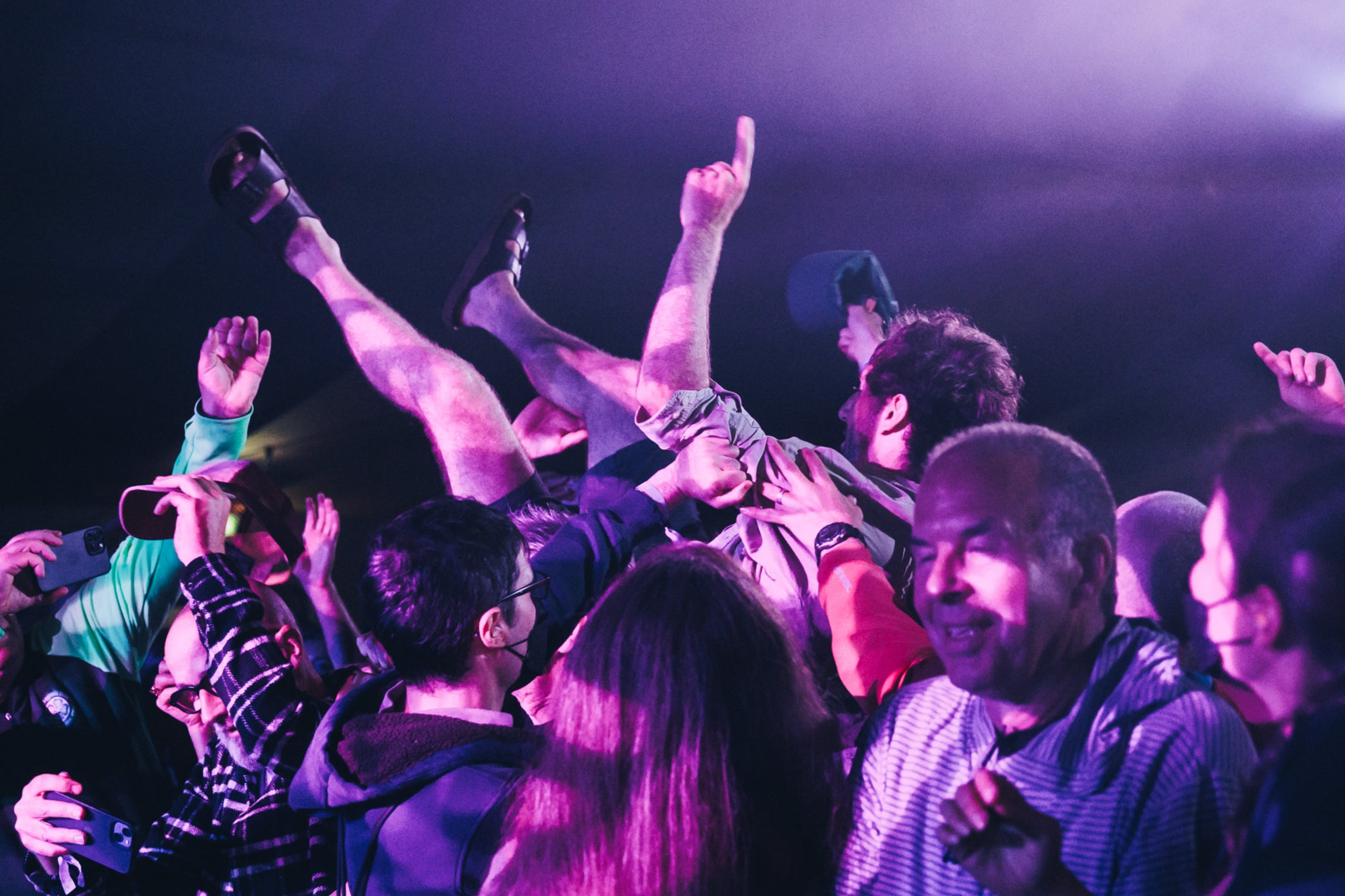 A man crowd-surfs at End of the Road 2023