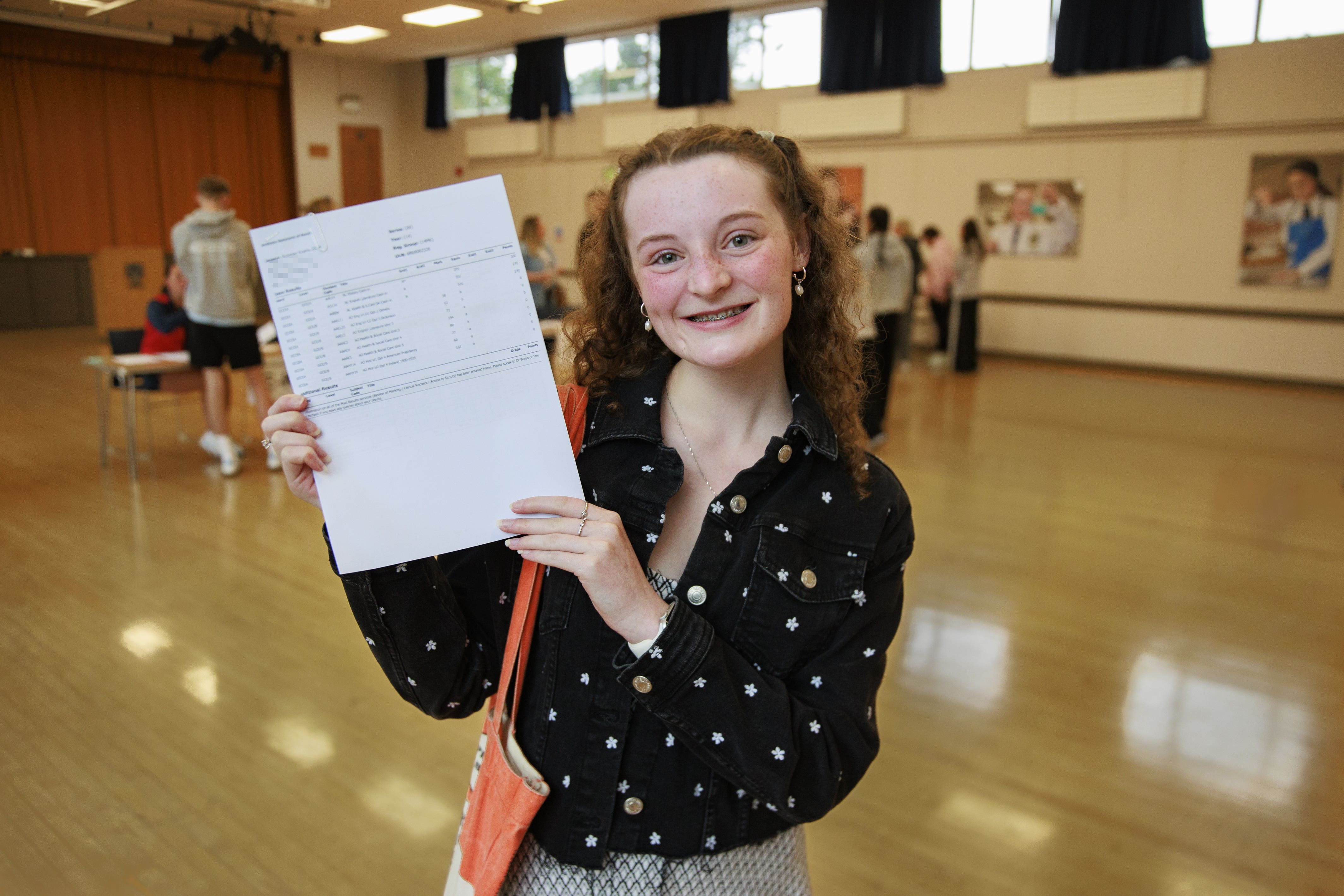 PIXELATION BY PA PICTURE DESK Emma Harris receiving her A-level results at Belfast High School (Liam McBurney/PA)