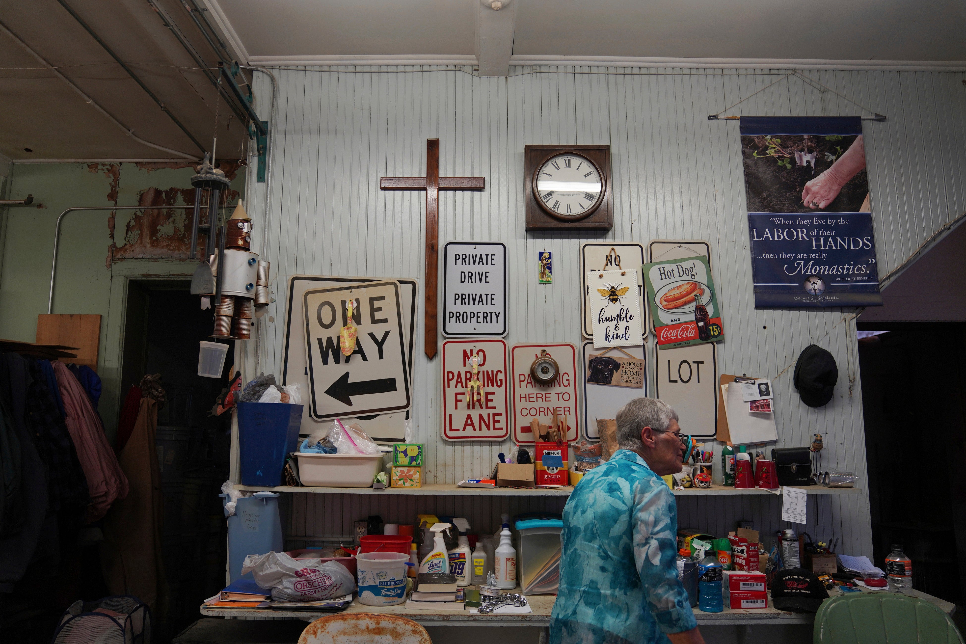 Sister Helen Mueting walks through the community’s workshop at the Mount St. Scholastica Benedictine monastery