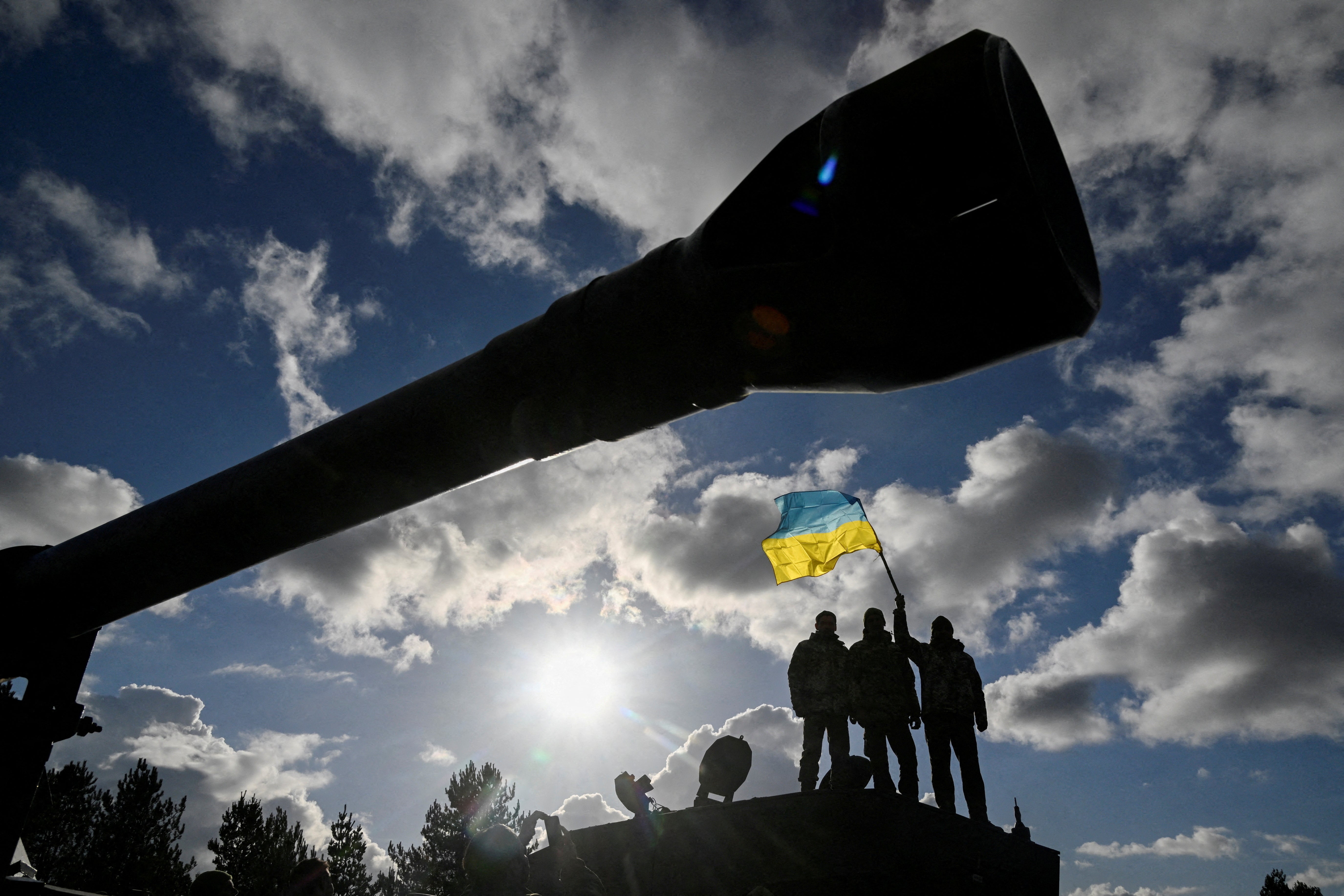 Ukrainian personnel stand on a Challenger 2 tank during training at Bovington Camp, near Wool, Hampshire