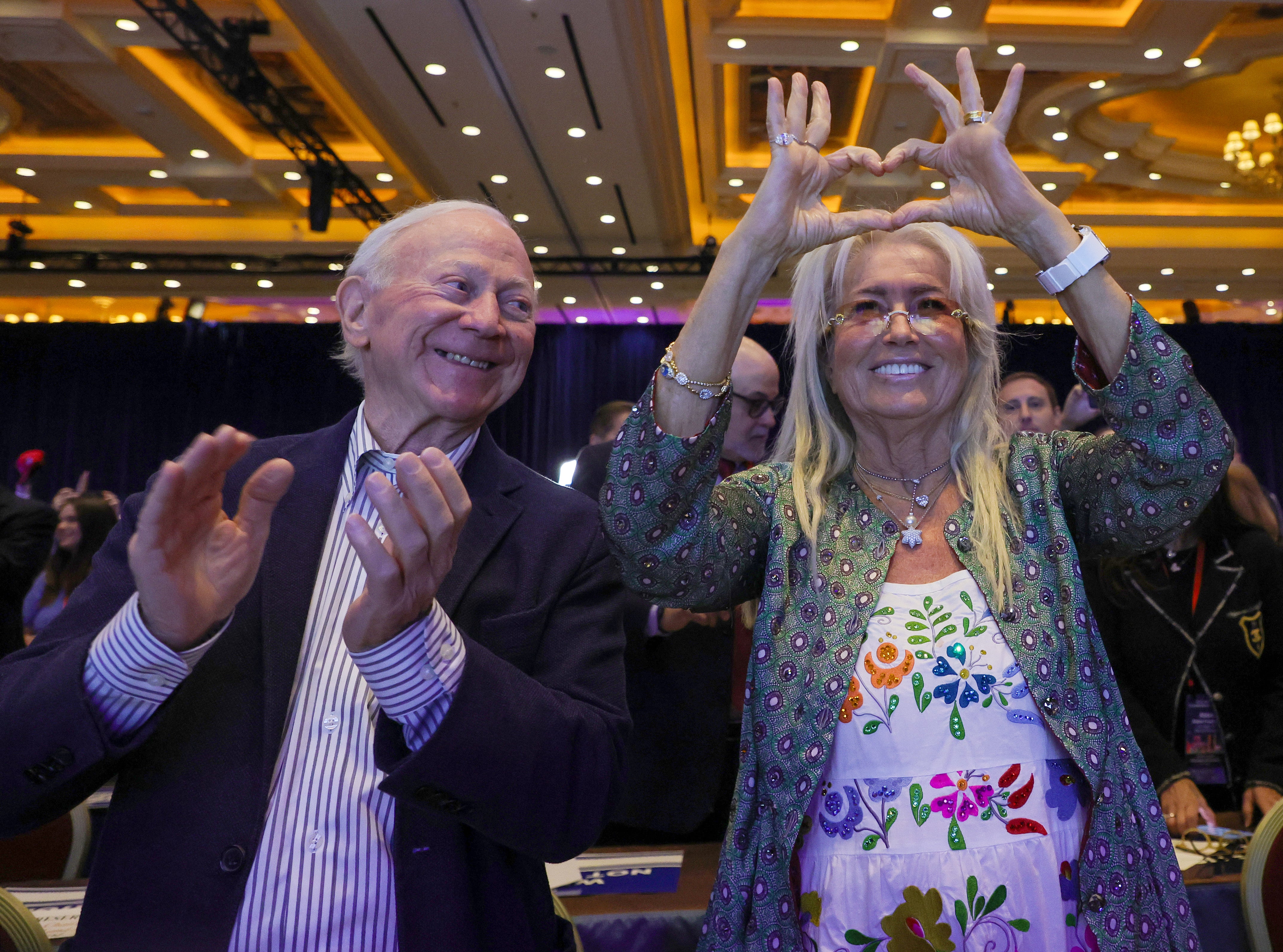 Miriam Adelson (left) makes a heart symbol as Republican presidential candidate Donald Trump is introduced at the Republican Jewish Coalition’s Annual Leadership Summit at The Venetian Resort Las Vegas on October 28, 2023