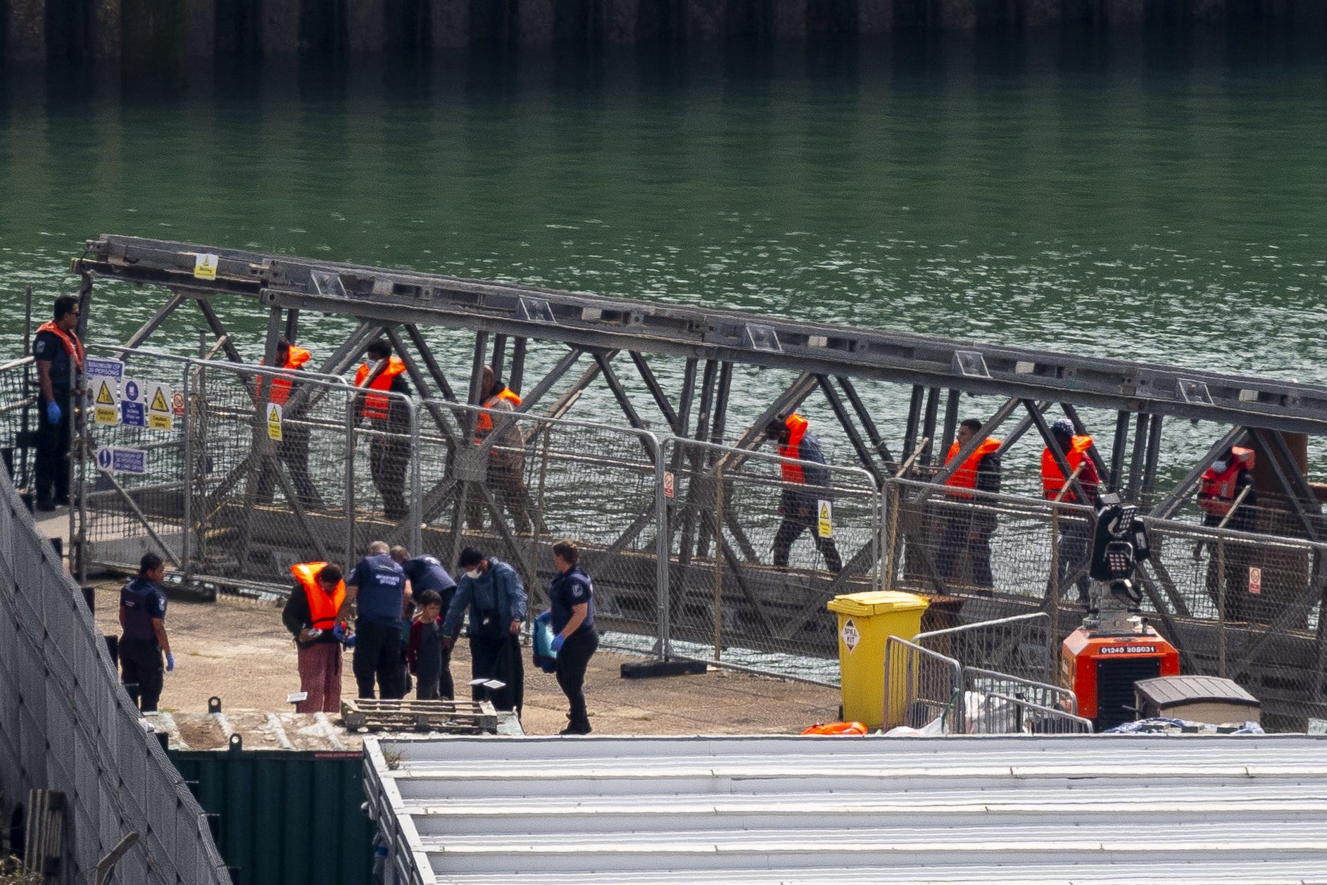 A group of people thought to be migrants are brought in to Dover (Jordan Pettitt/PA)