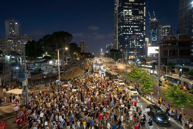 <p>Protesters in Israel march to demand their government negotiate a return for hostages still held by Hamas </p>