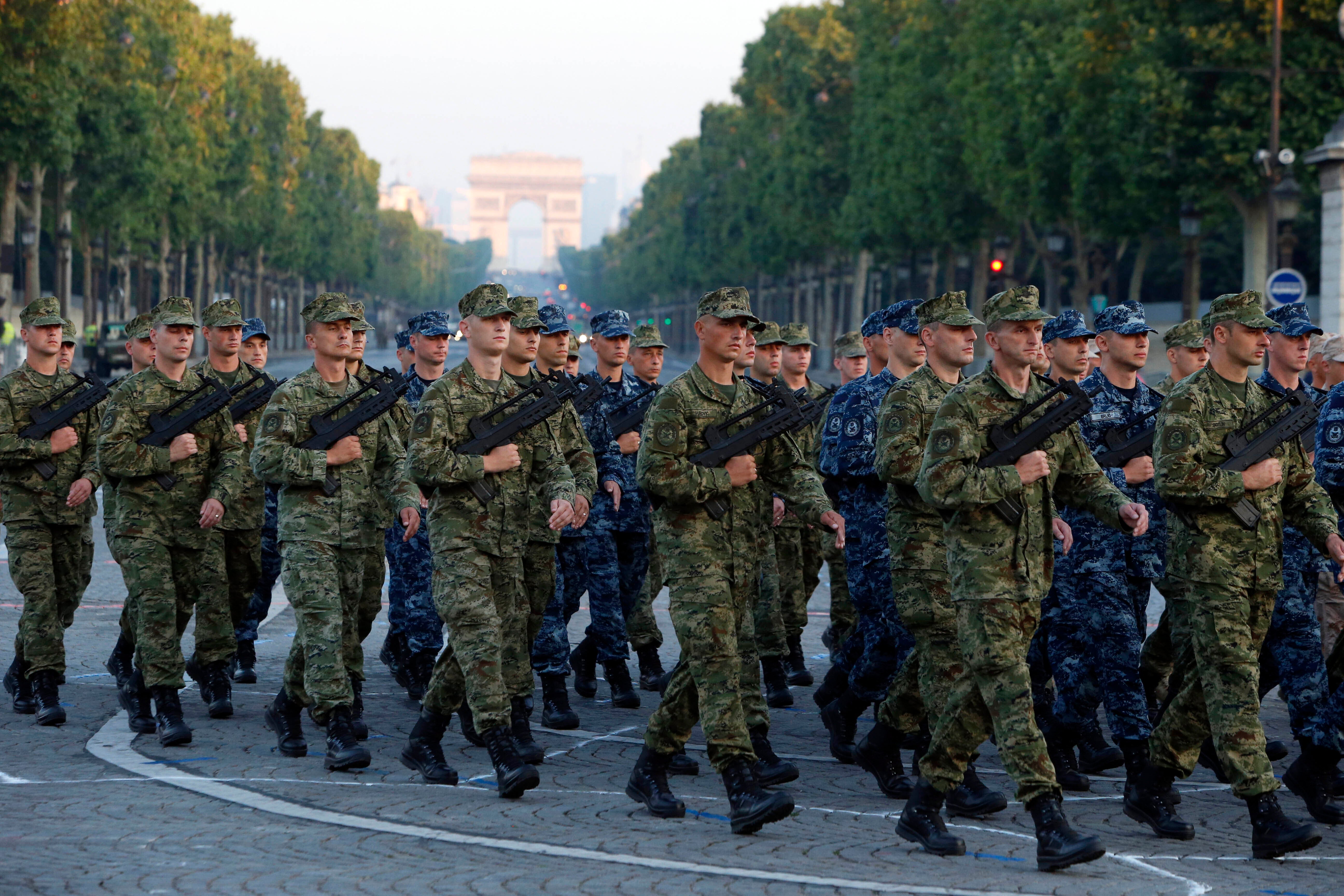 Army Forces of Croatia walk during the rehearsal of the French Bastille Day parade at the Champs-Elysees avenue in Paris, Tuesday, July 9, 2013