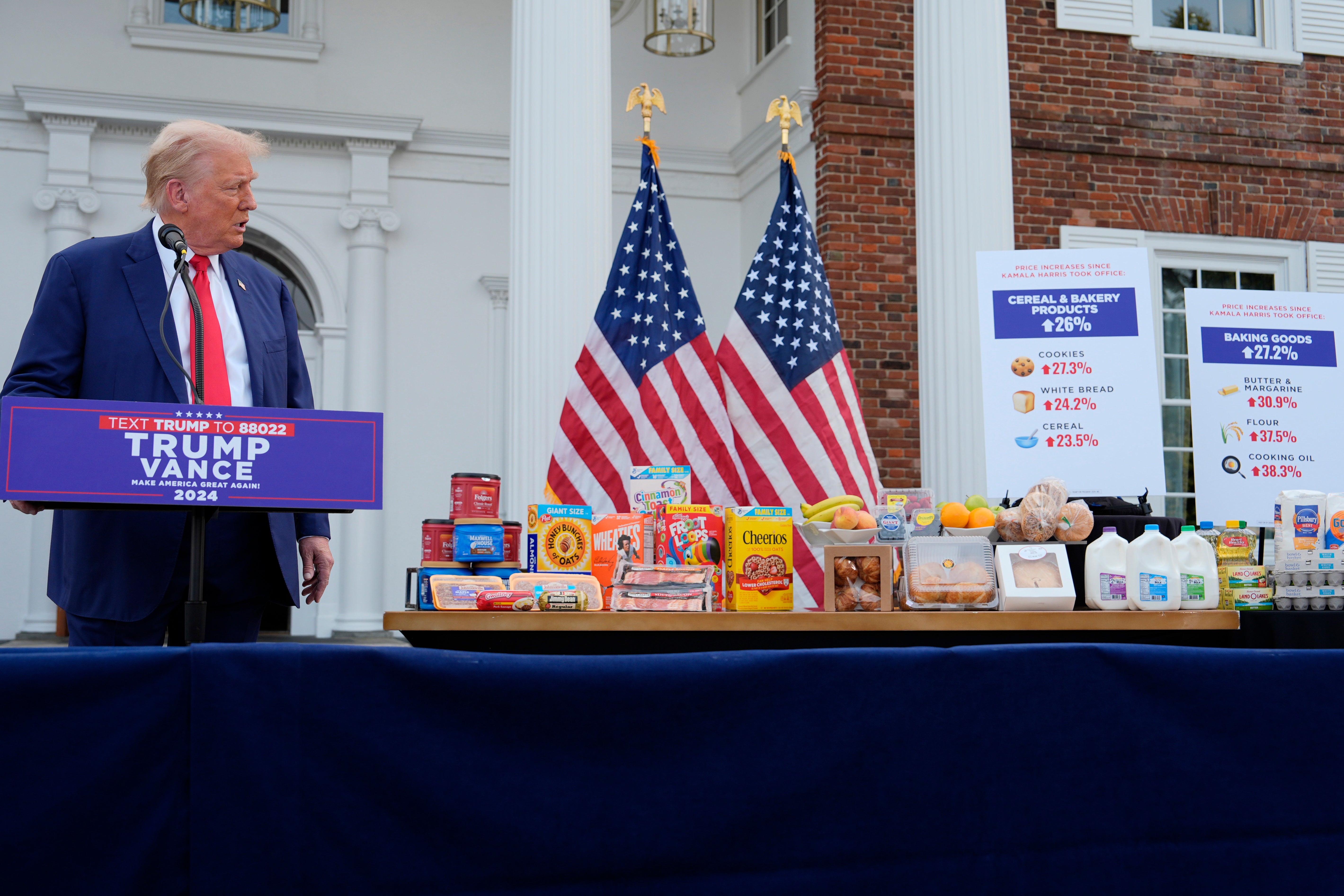 Donald Trump admires a box of Cheerios during a press conference in Bedminster, New Jersey