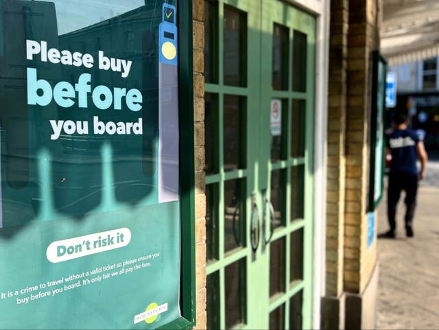 <p>Ticketless trouble: Poster at Eastbourne station warning of penalties for fare-dodging</p>