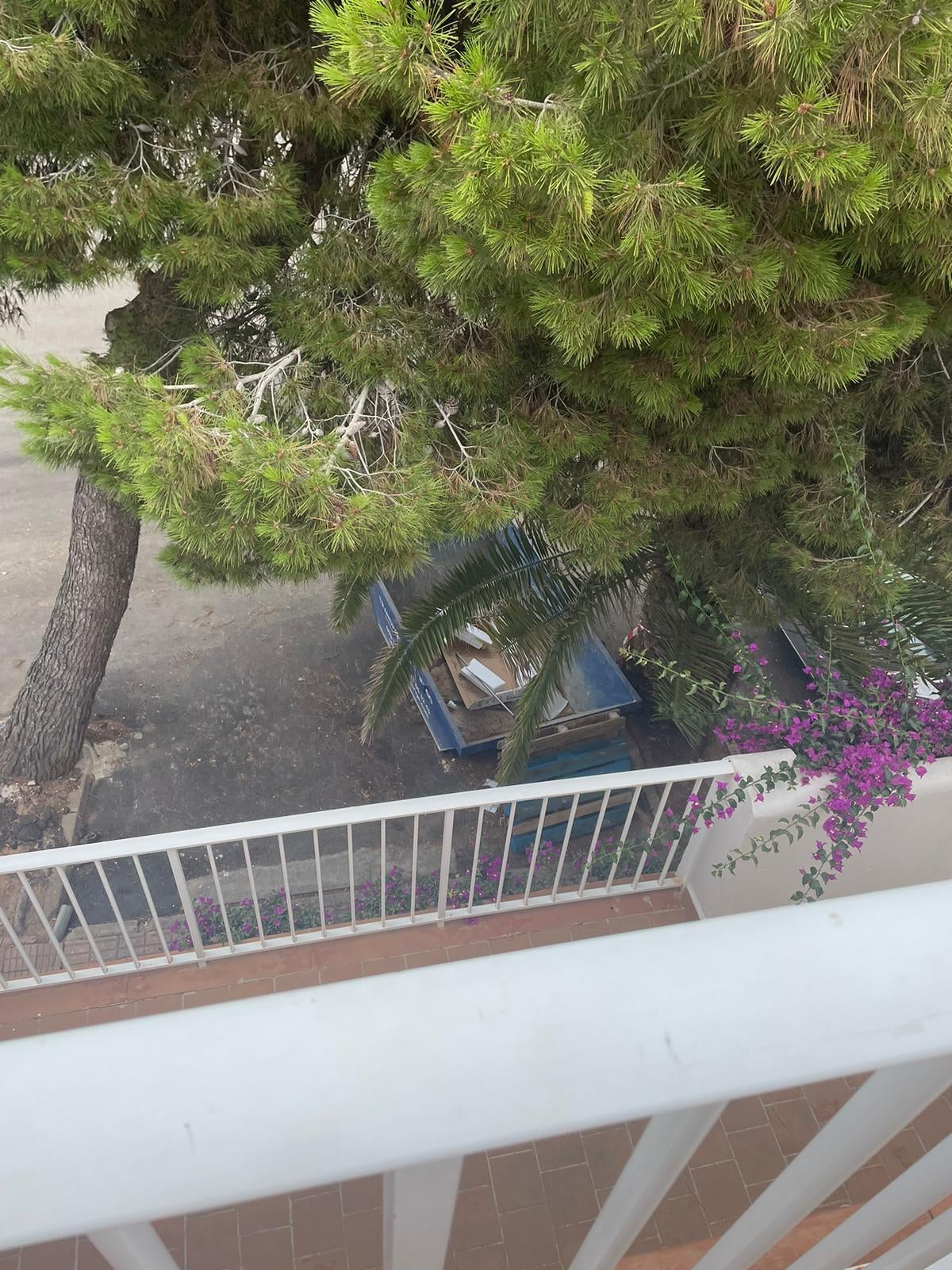 Mark and Nadia said their balcony overlooked a car park with a skip and bins