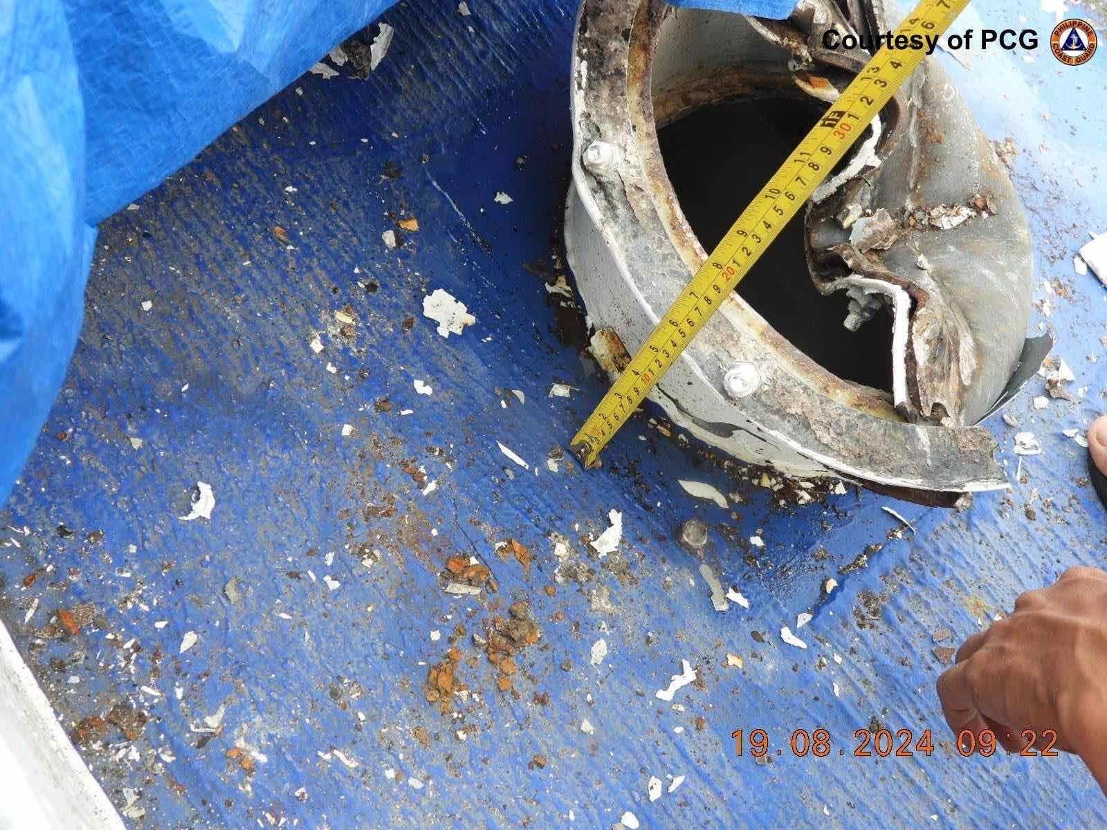 A handout photo made available by the Philippine coast guard shows the damaged ship BRP Cape Engano