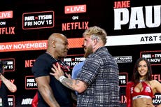 Jake Paul and Mike Tyson engage in strange shoving match at face-off for rearranged fight