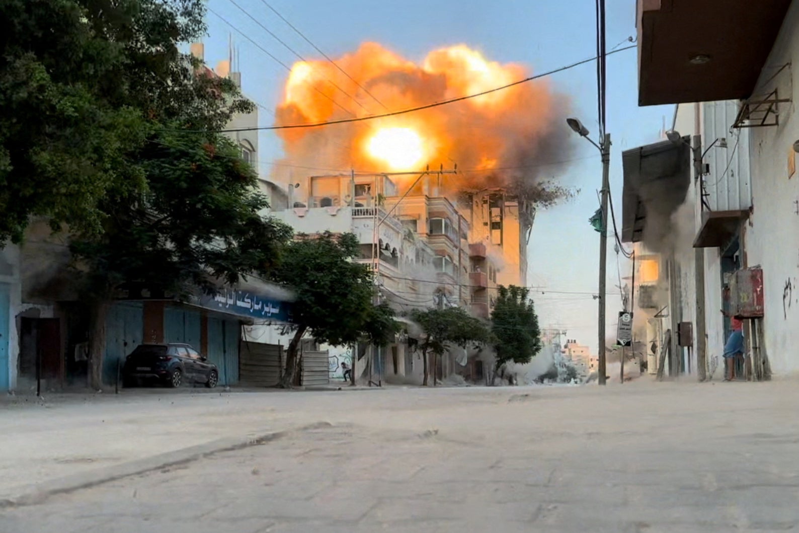 Smoke and flames rise following an Israeli strike in central Gaza