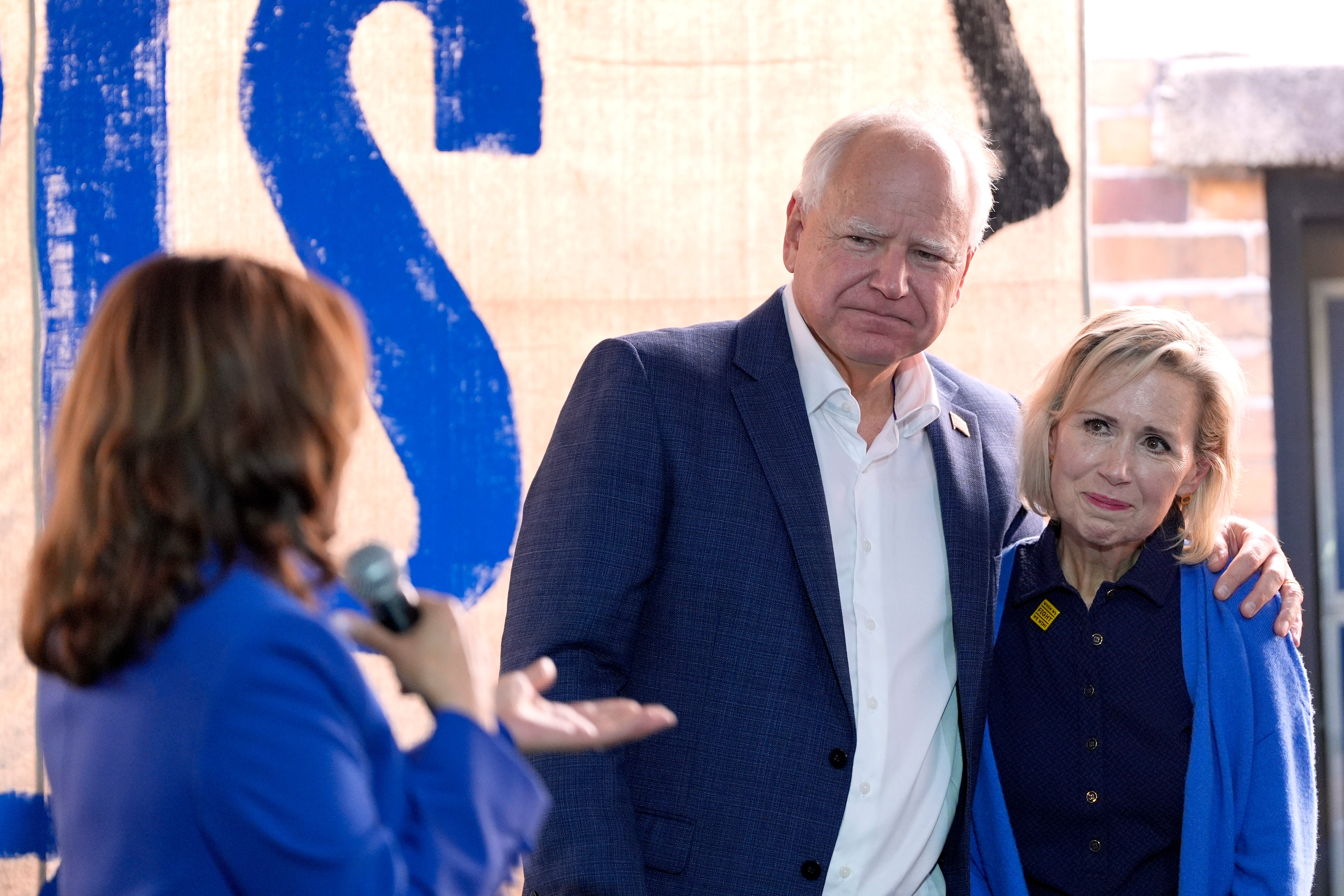 Kamala Harris, the Democratic presidential nominee and vice president, addresses Democratic vice presidential nominee Tim Walz, governor of Minnesota, and his wife Gwen Walz at a campaign event in Rochester, Pennsylvania