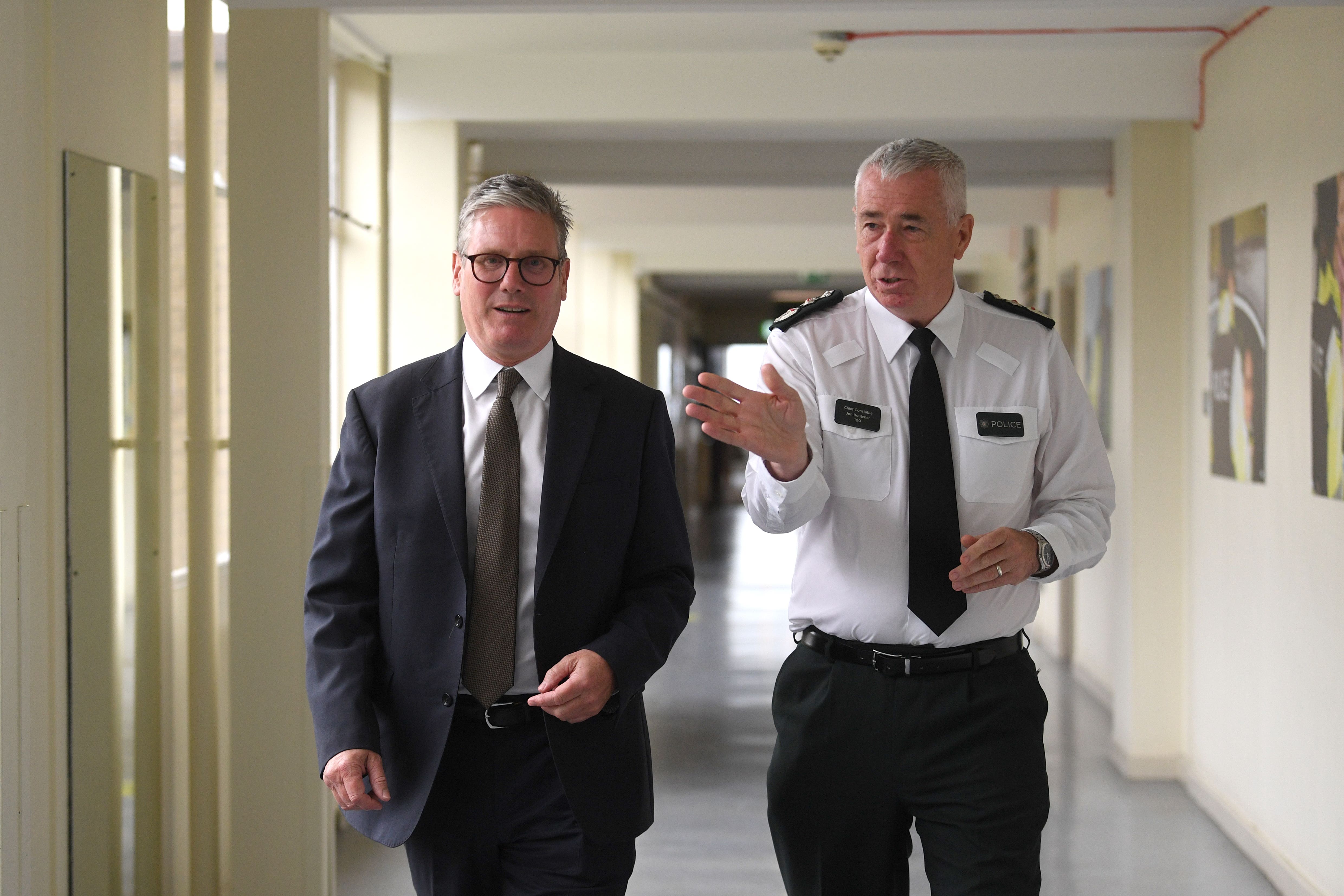 Sir Keir Starmer, left, held talks with senior PSNI leadership including Chief Constable Jon Boutcher, right (Charles McQuillan/PA)