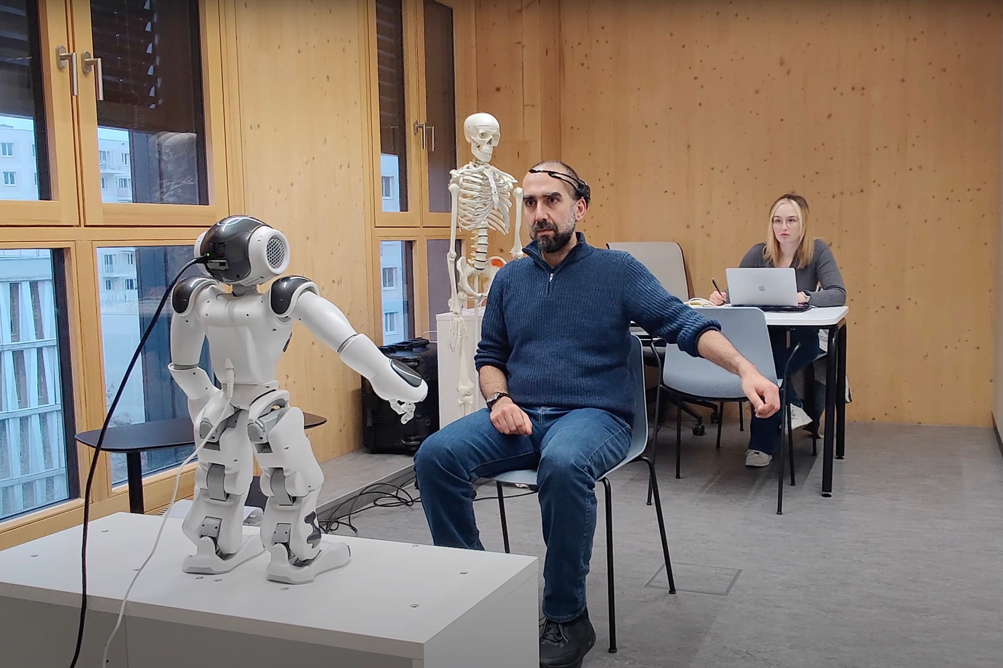 Researchers trialling a robot coach using a head band that can interpret brain signals (Lynne Baillie/National Robotarium/PA)