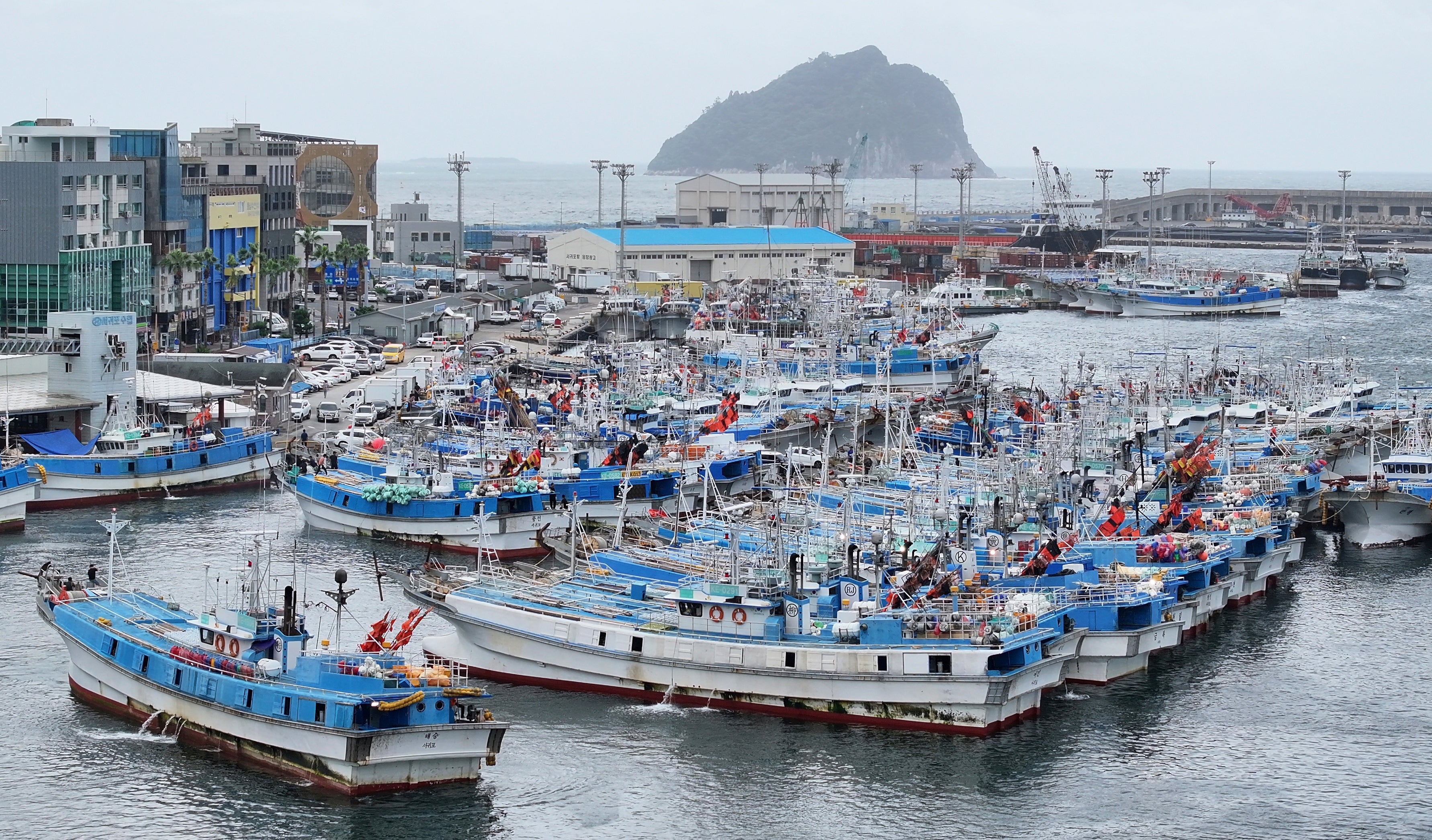 Fishing boats are anchored at a port as Typhoon Jongdari approaches Jeju Island, South Korea,