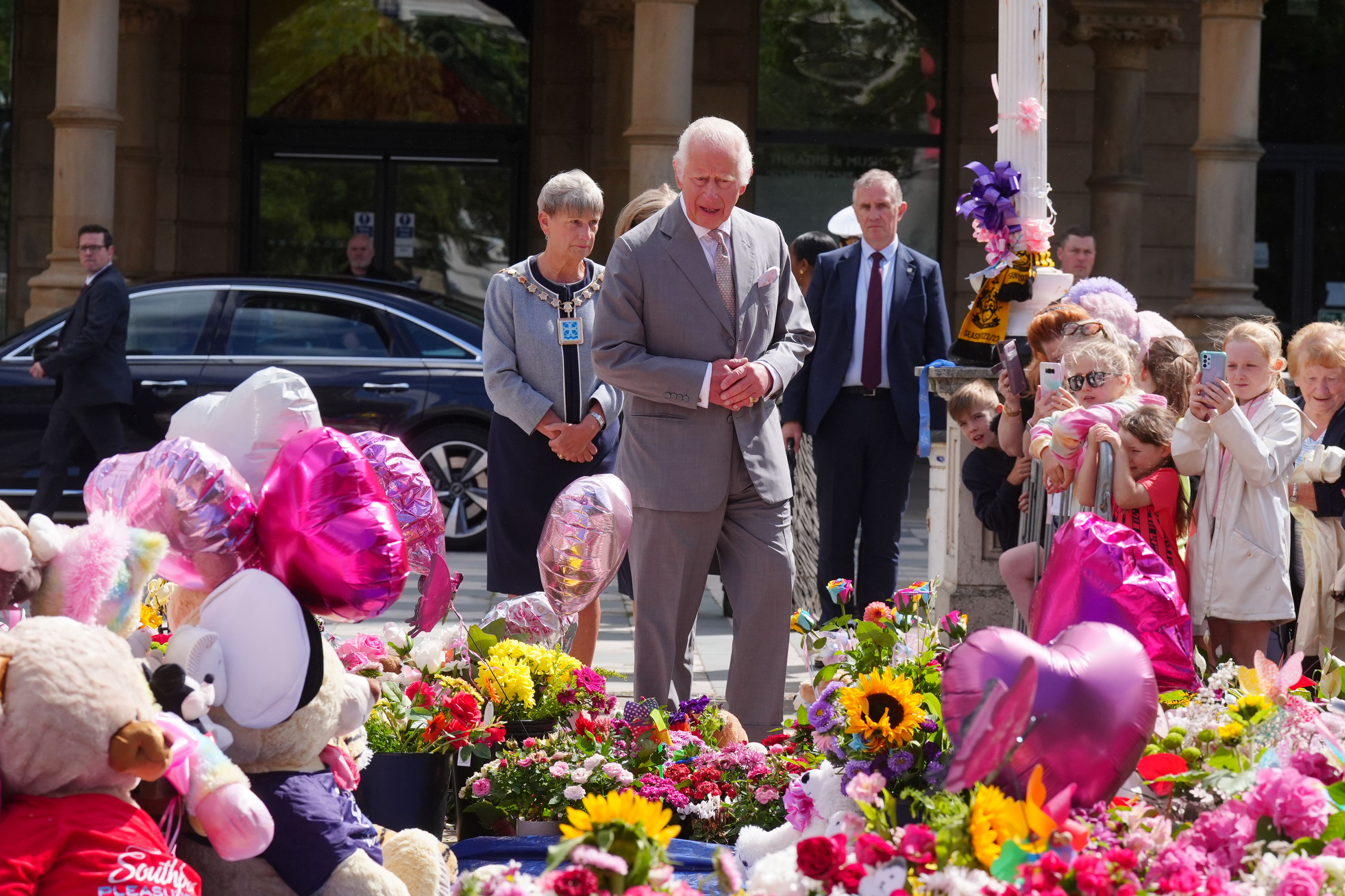 The King viewed tributes left outside the Atkinson Art Centre in Southport (Owen Humphreys/PA)