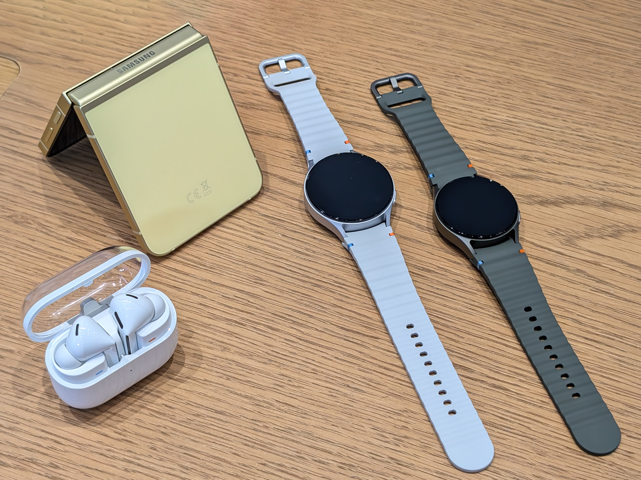 The Galaxy Watch 7 in both sizes next to the new Galaxy Z Flip 6 and Galaxy Buds 3 Pro