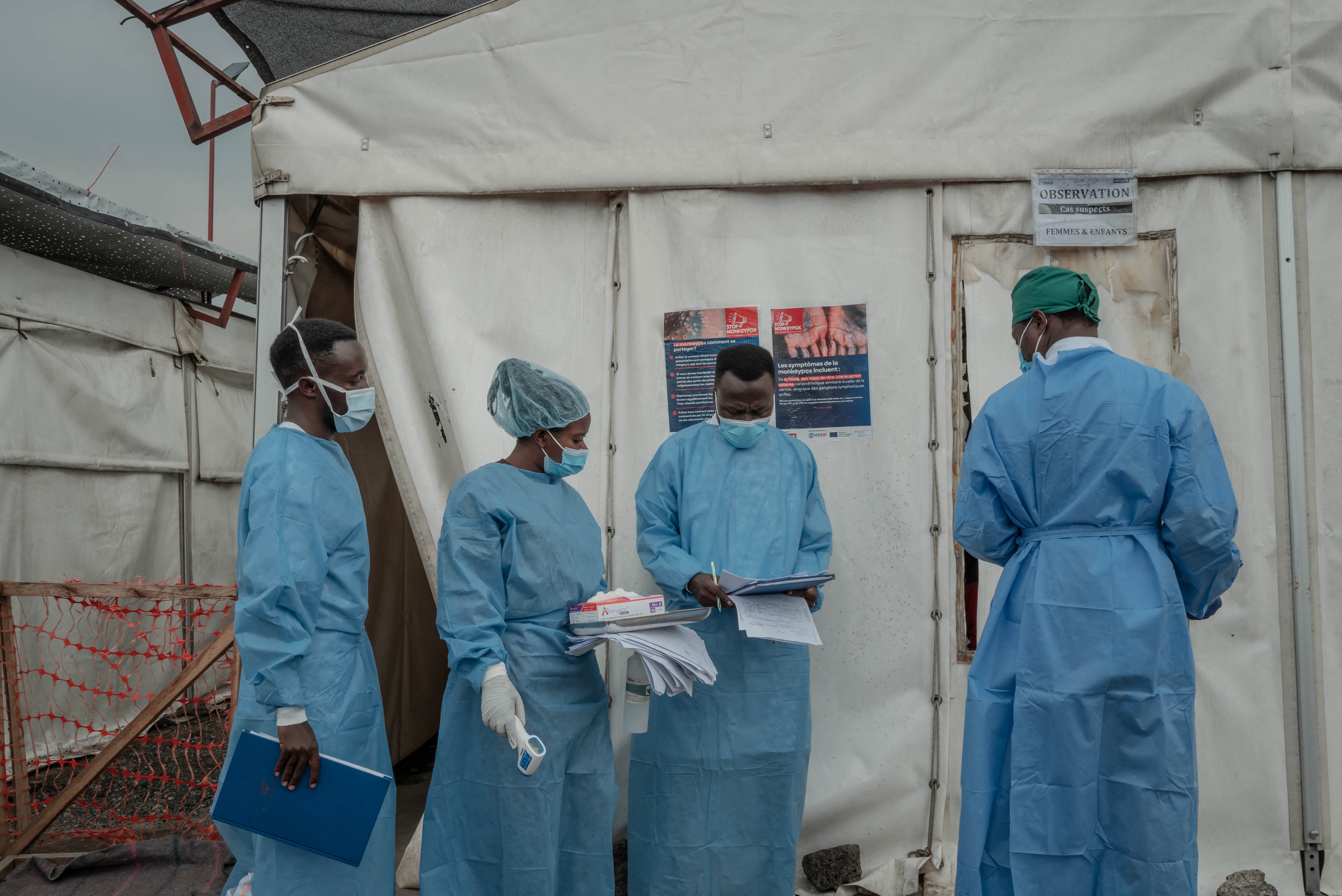 Health workers walk between wards at the Mpox treatment centre at Nyiragongo General Referral Hospital, north of Goma, Congo