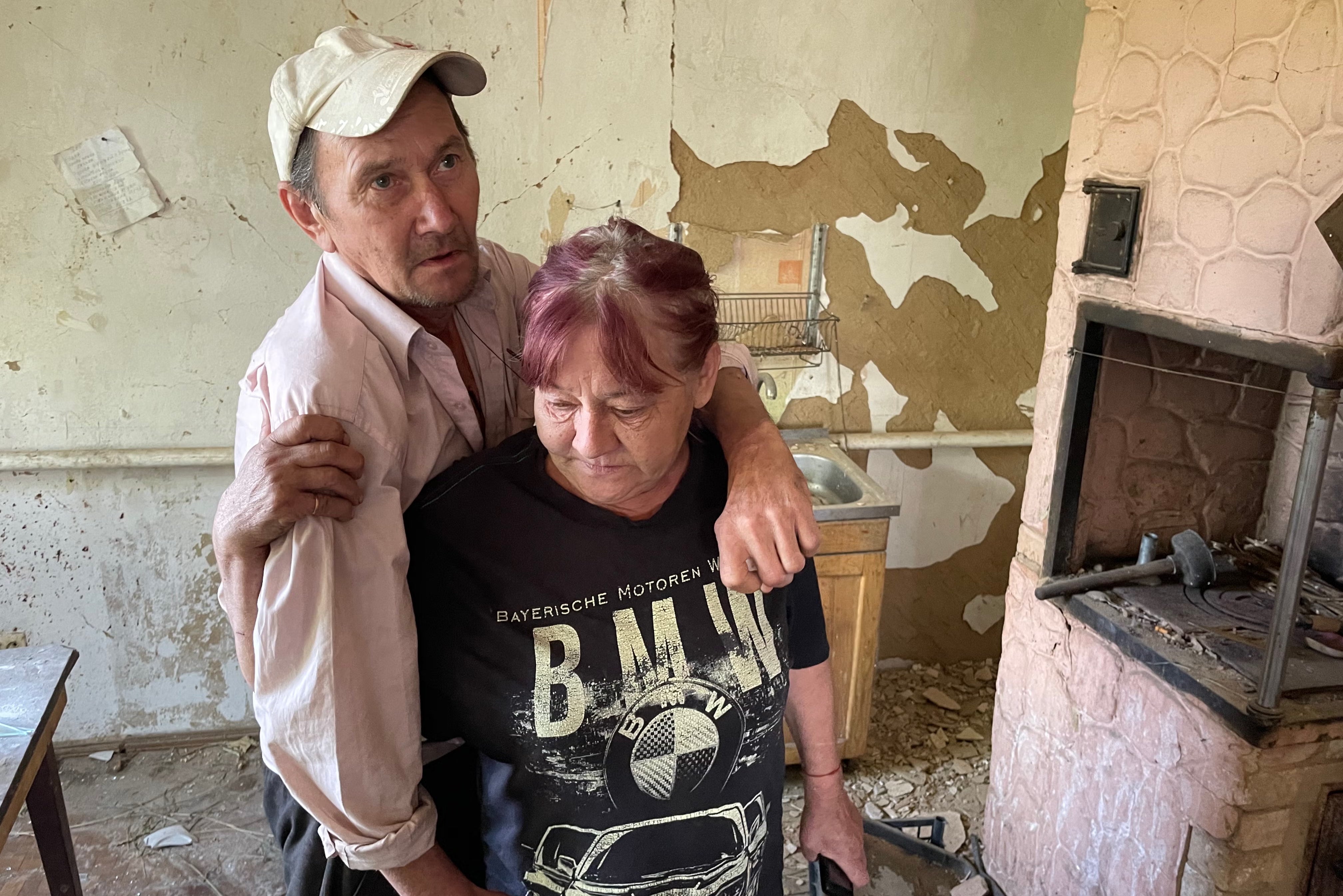 Alla, 52, and her husband Sasha, 61, in their home close to the Russia border, which has been damaged by Russian glide bombs