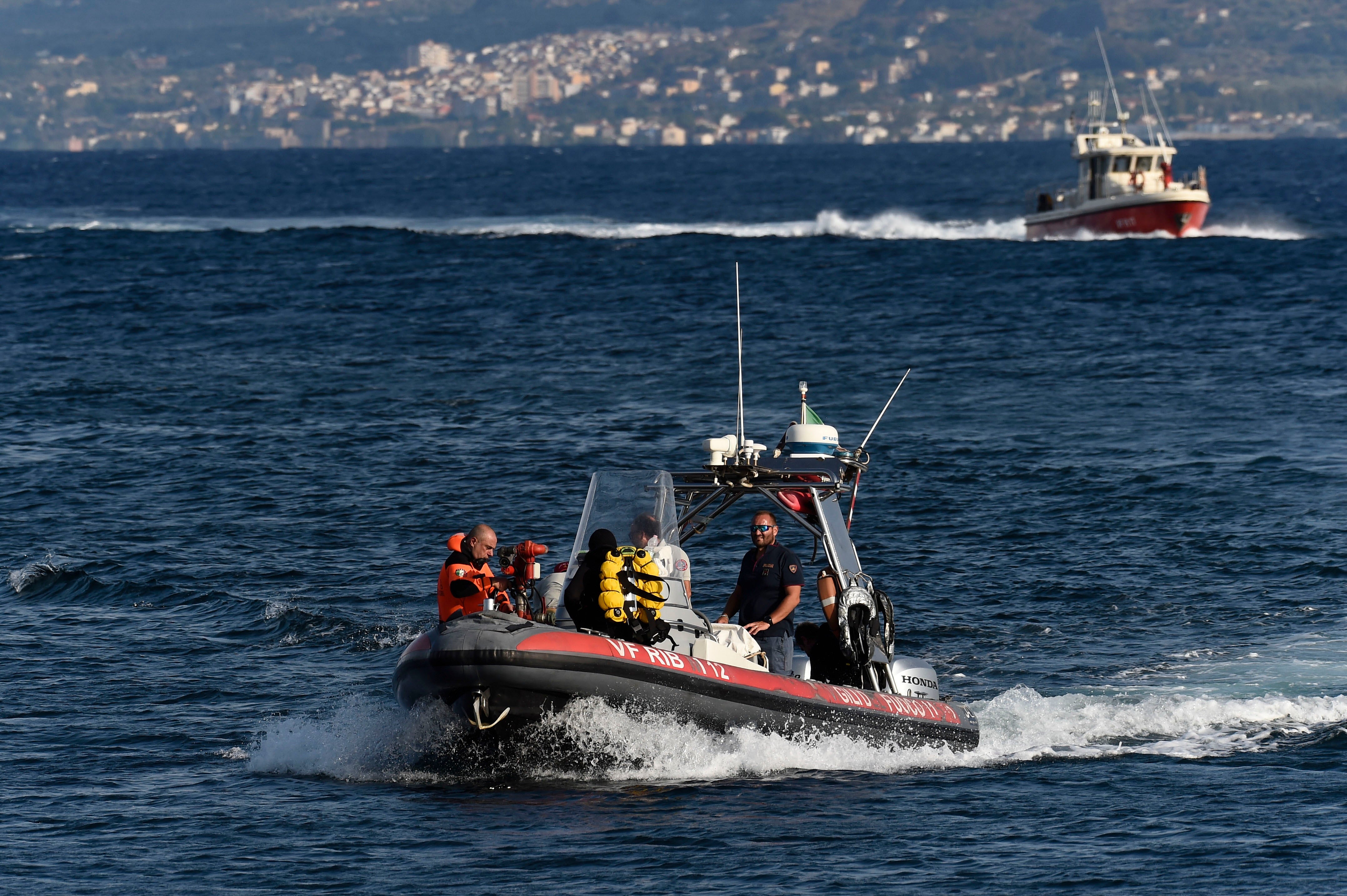 Emergency workers search for the missing Bayesian superyacht in southern Italy on August 20