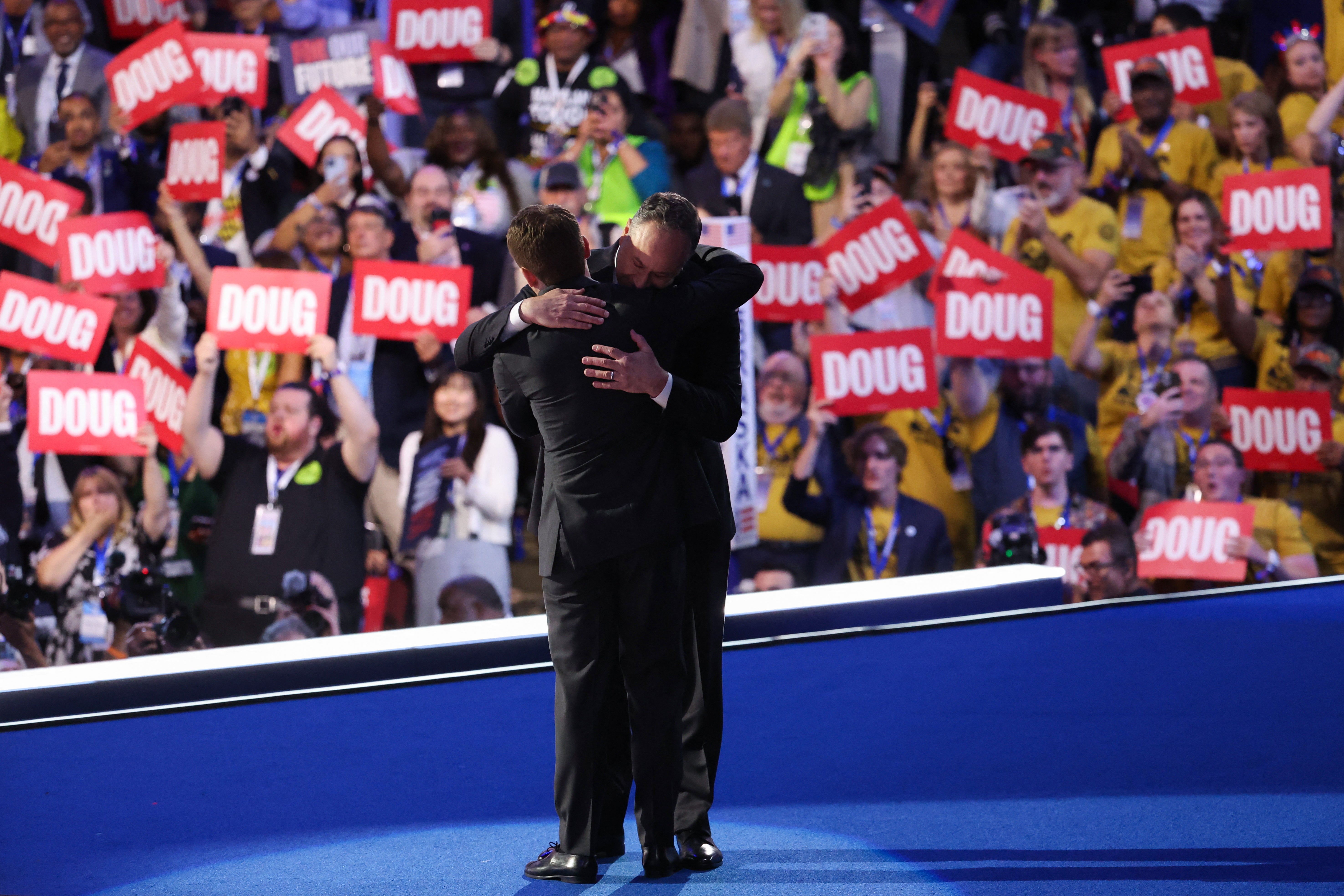 Second gentleman Doug Emhoff embraces his son, Cole Emhoff, on the second night of the Democratic National Convention in Chicago