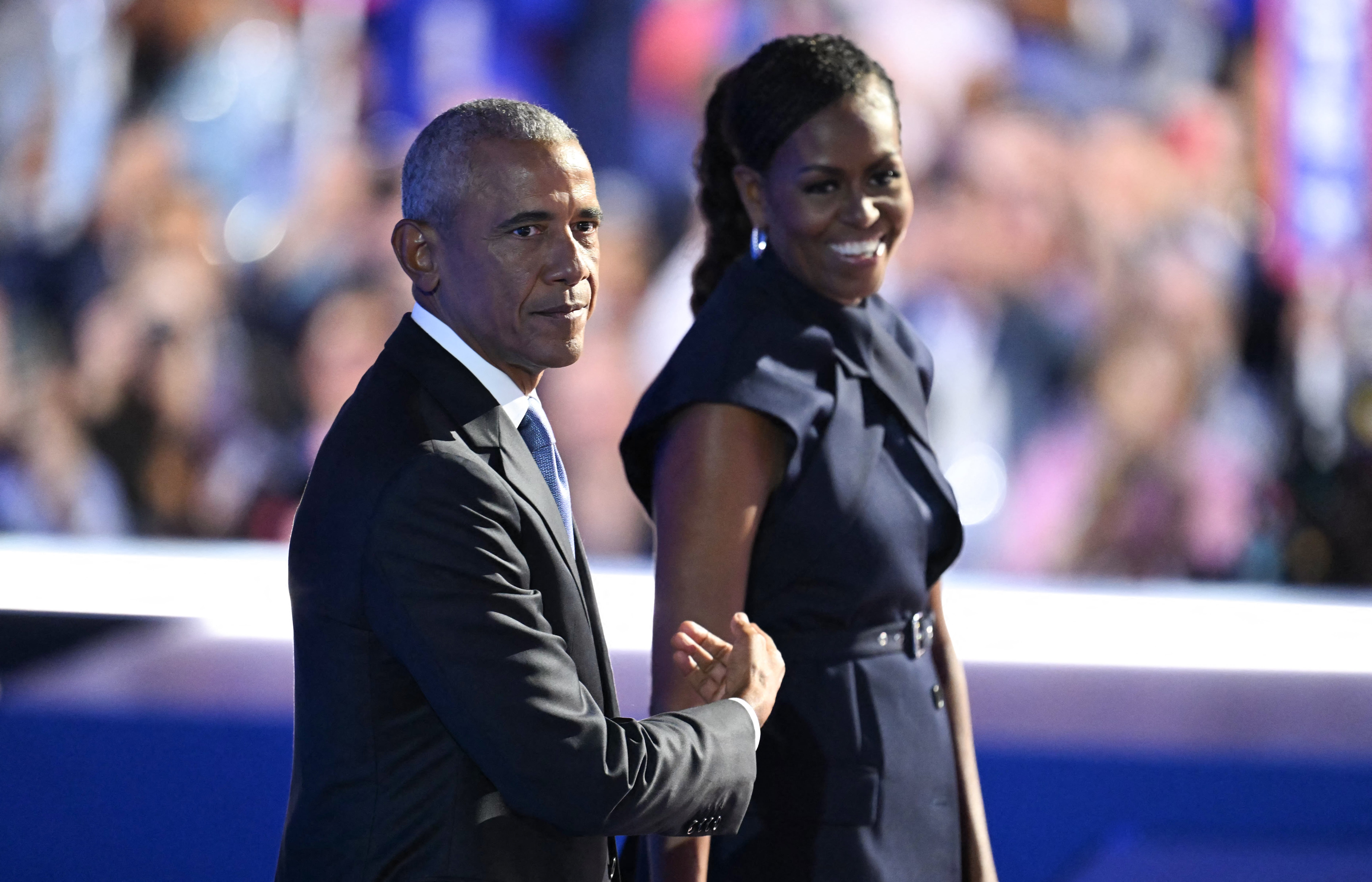 Barack Obama and his wife Michelle stand on stage after she introduced him at evening two of the DNC