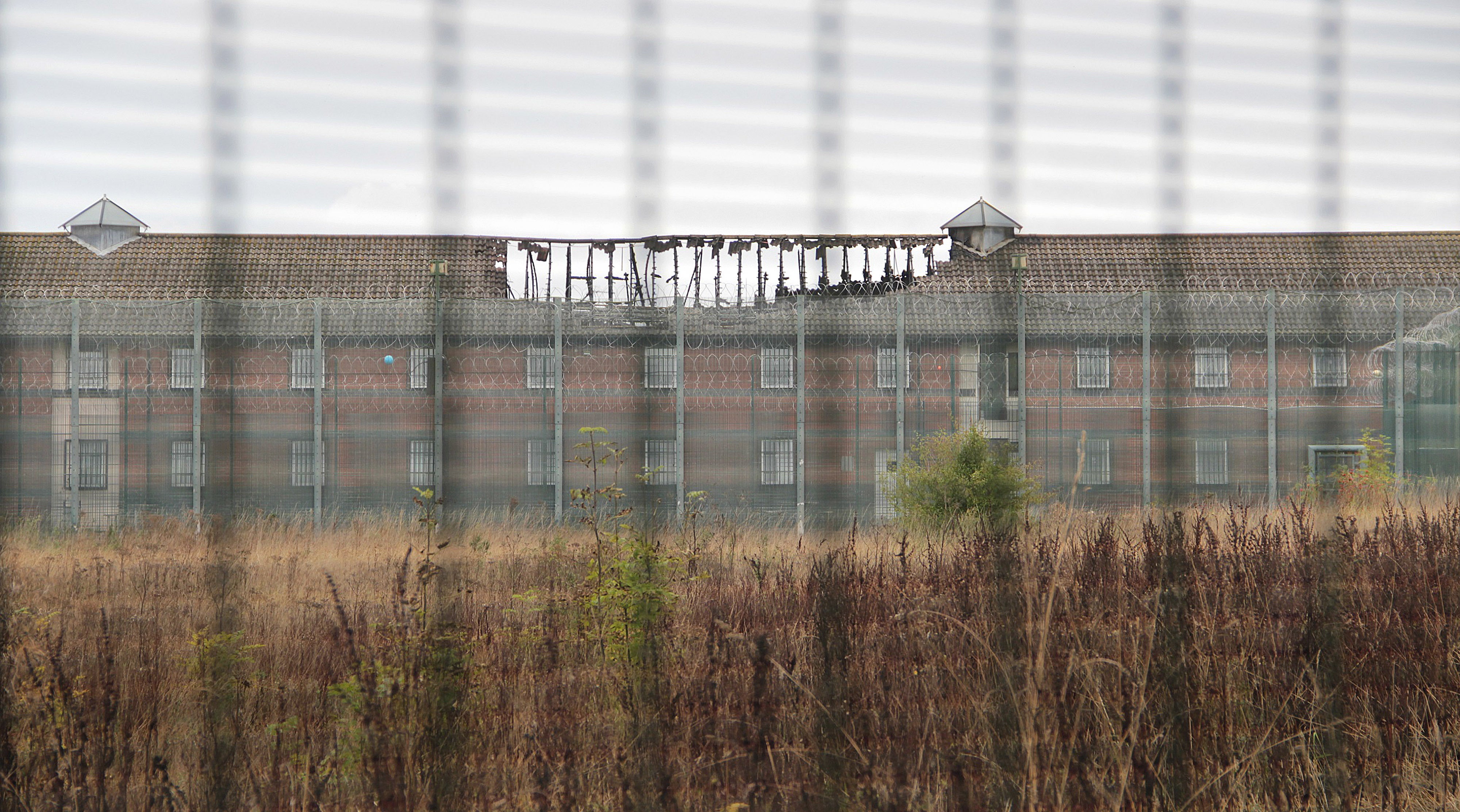 The roof of one of the detention blocks at the privately-run Campsfield Immigration Centre in Kidlington, Oxfordshire after it was damaged by a fire.