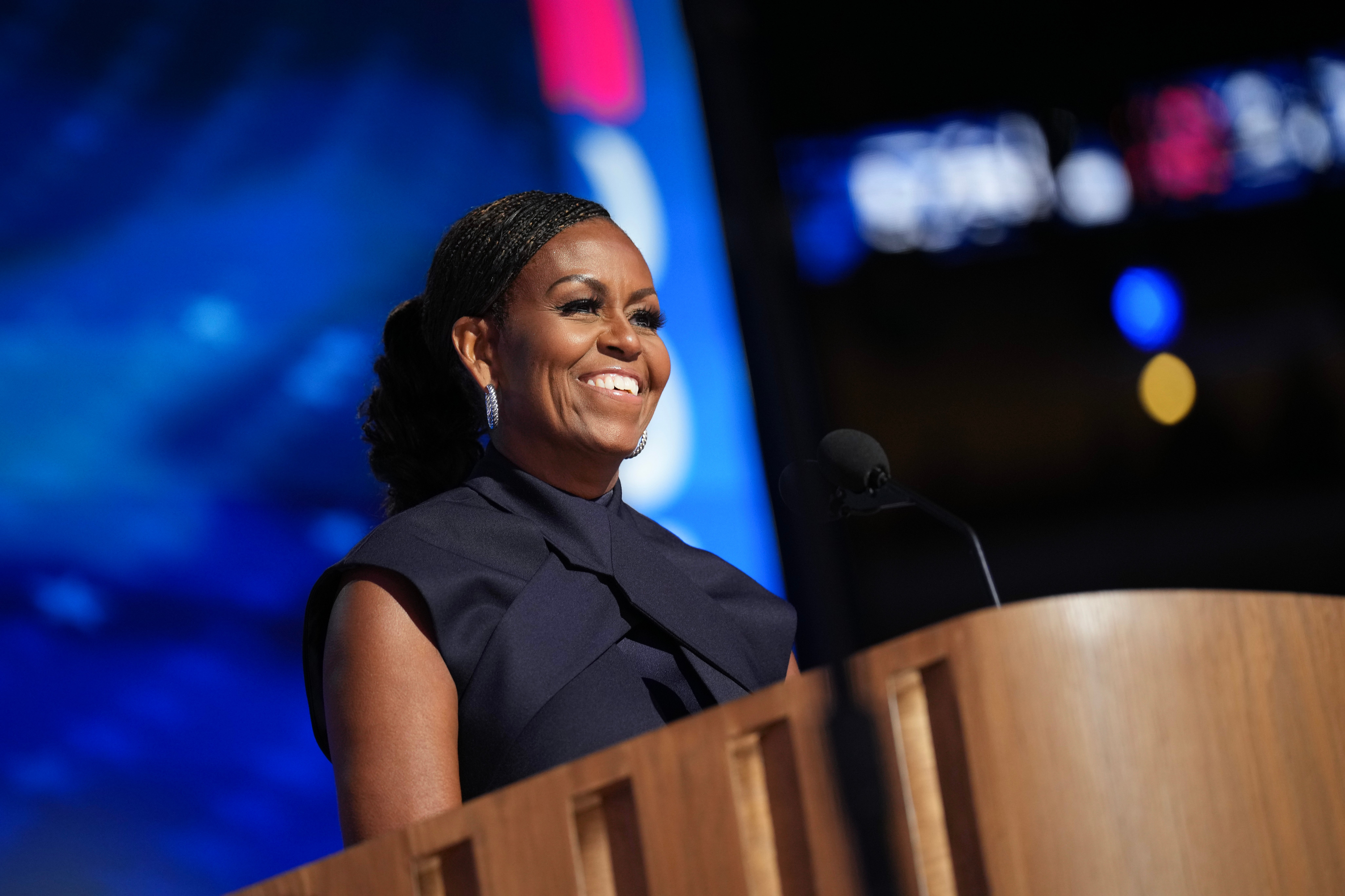 Michelle Obama speaks during the second day of the Democratic National Convention in Chicago. She earned the praise of Fox News hosts while Eric Trump called her speech ‘unwatchable’