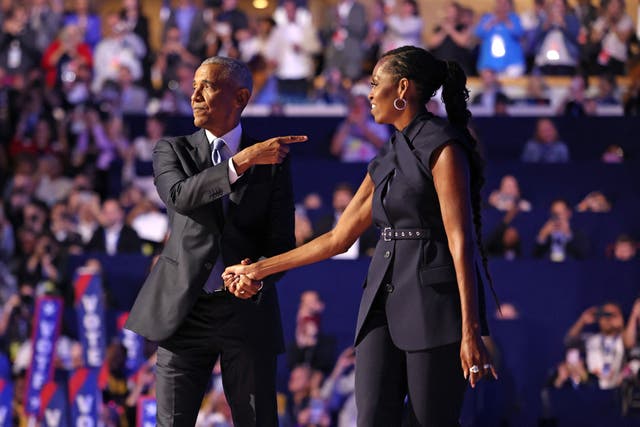 <p>Michelle Obama introduces Barack Obama at the Democratic National Convention in Chicago on Tuesday night </p>